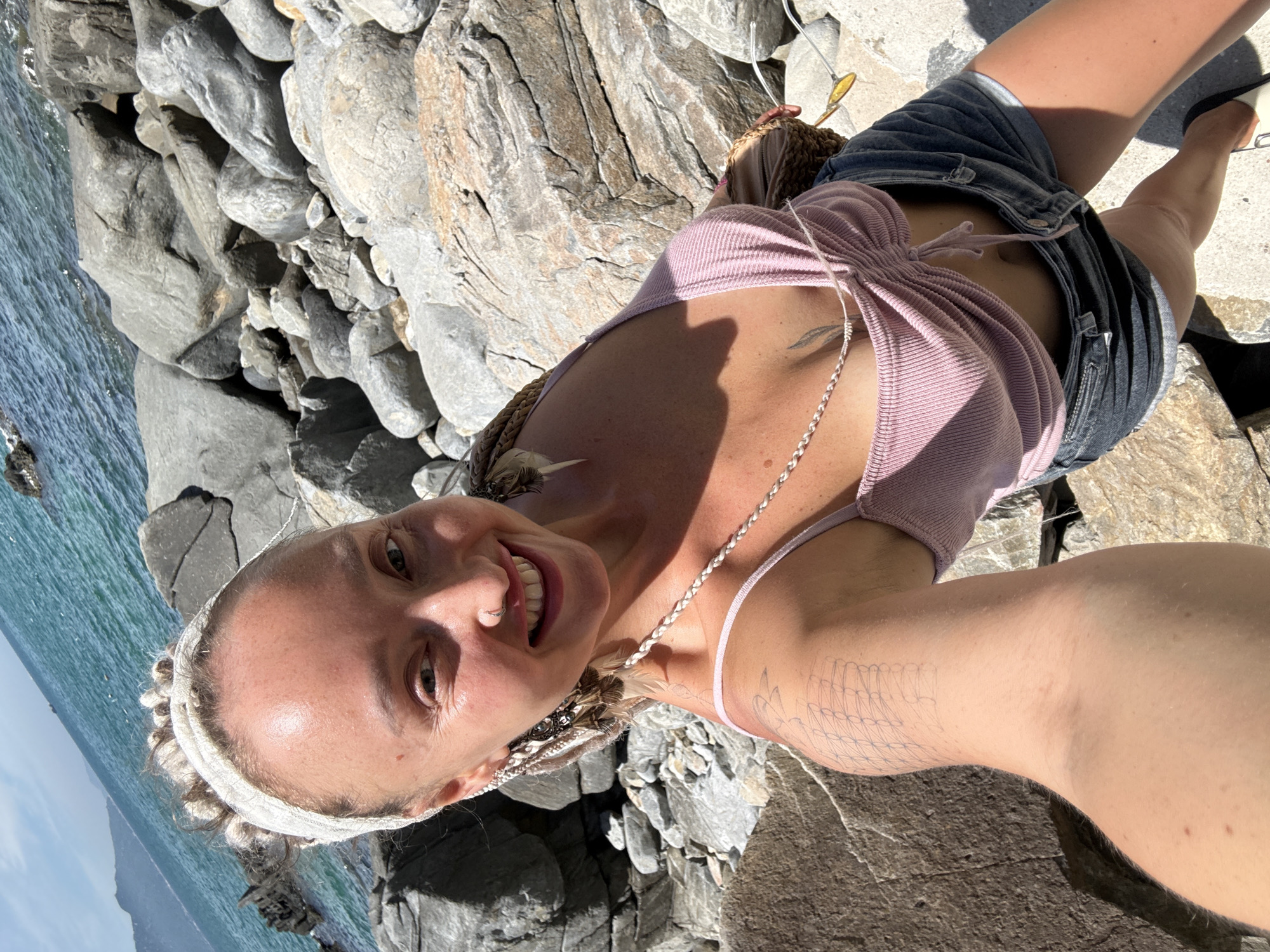 Selfie session on a rugged coastal rock formation in Vietnam