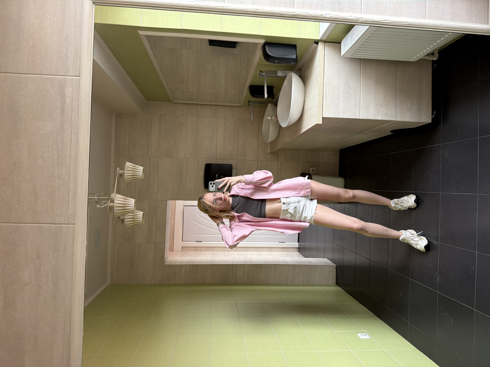 Woman takes bathroom selfies in Briceni, Moldova