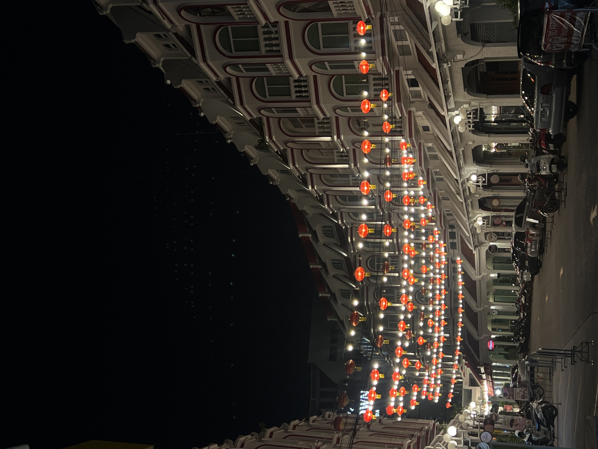 Nighttime street photography captures Phuket architecture with festive lighting