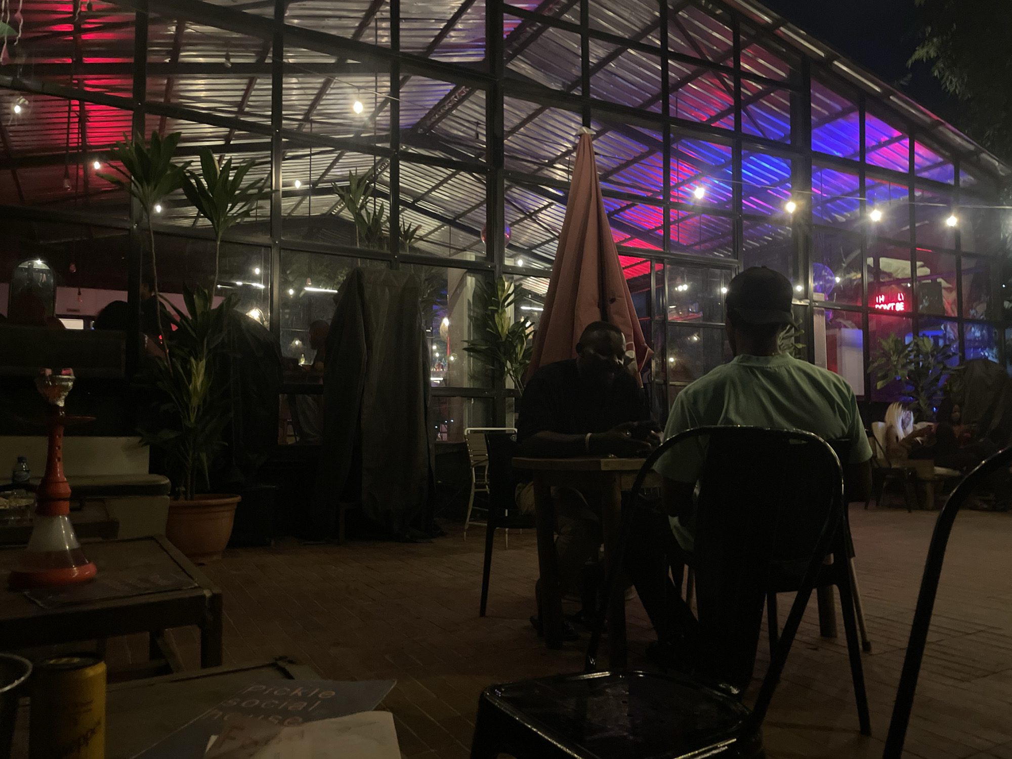 Evening at a glass-roofed lounge in Abuja
