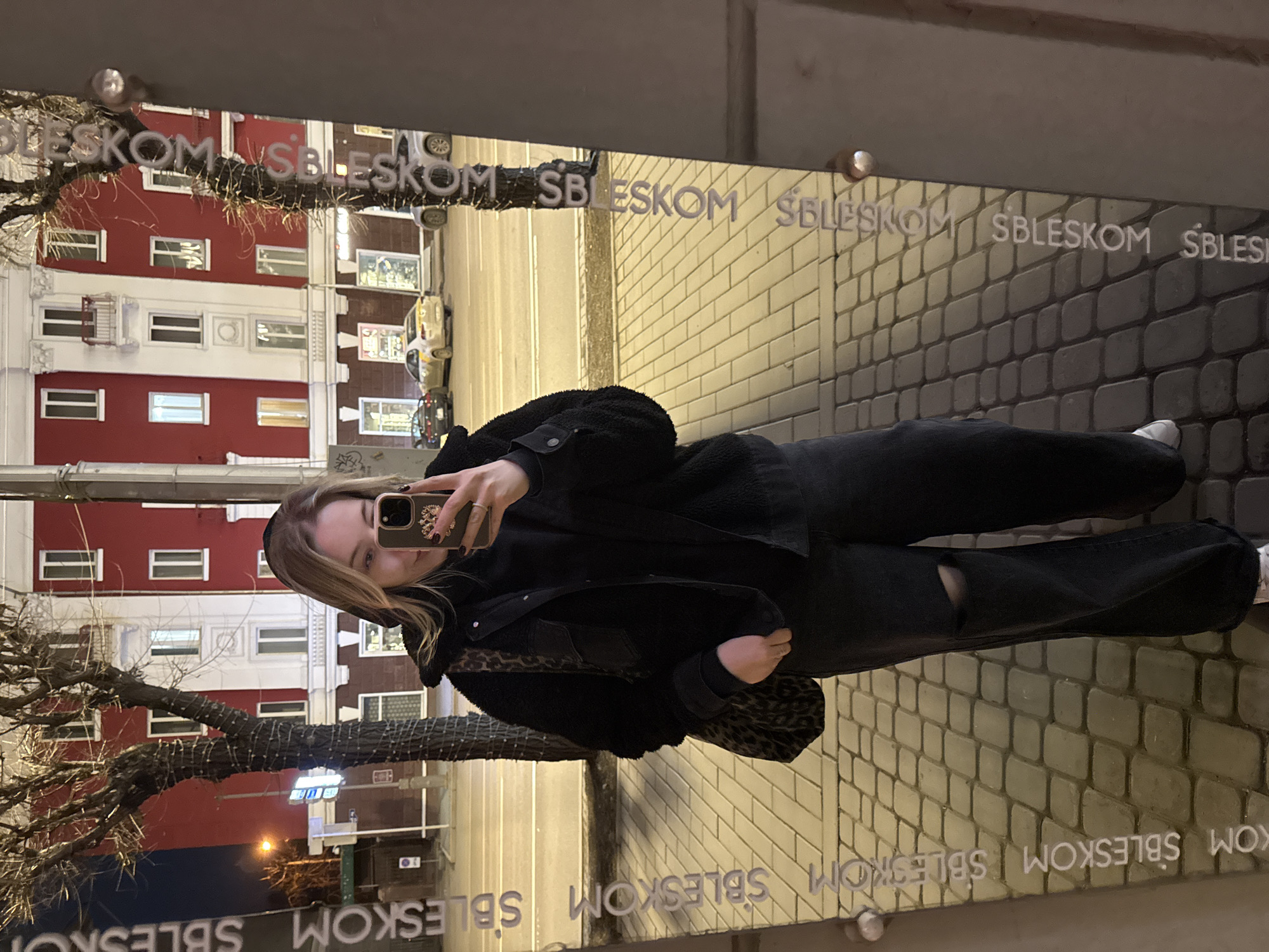 Woman takes mirror selfie on Krasnoyarsk street