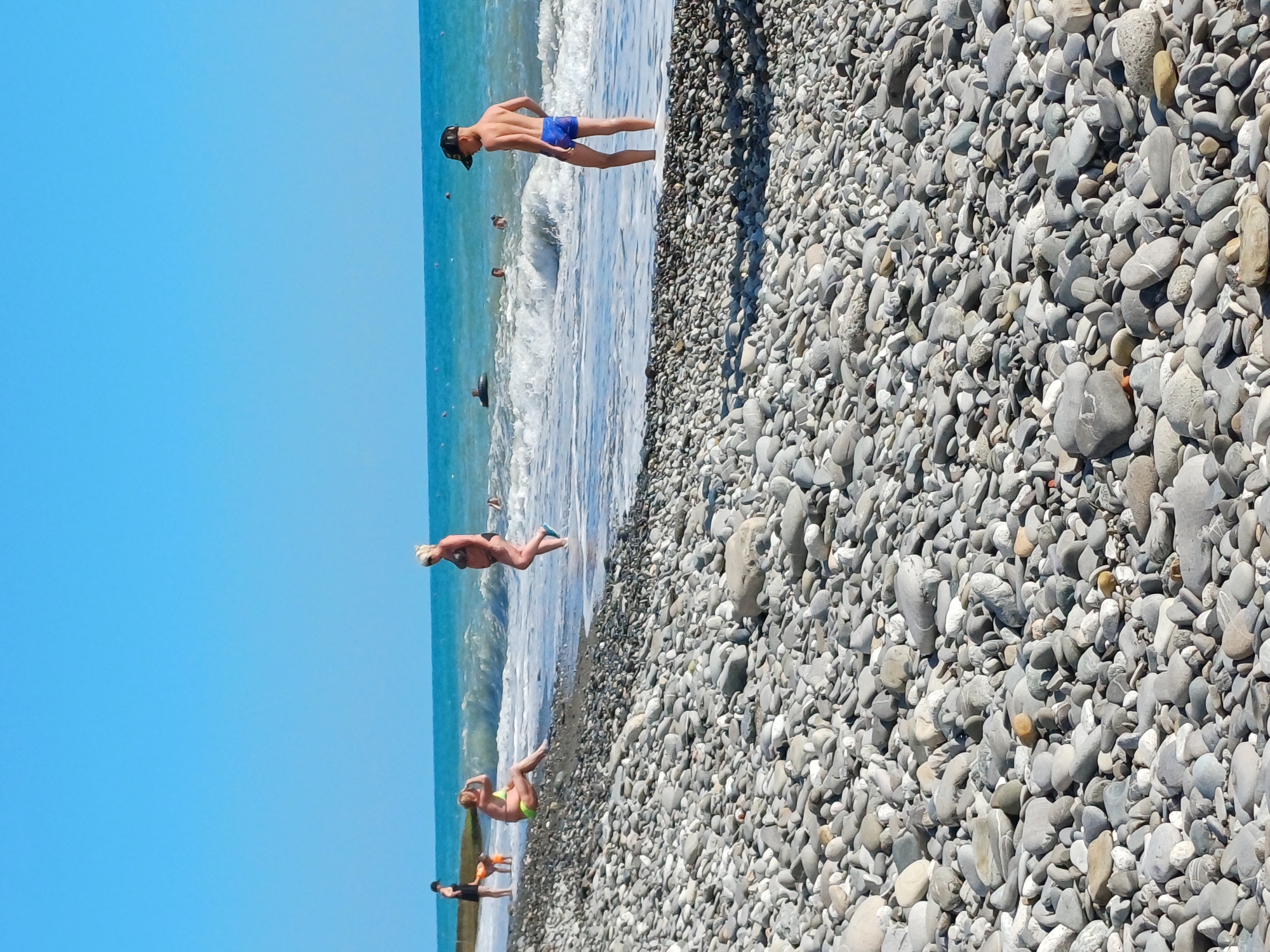 Busy afternoon at Sochi's pebble beach on Black Sea