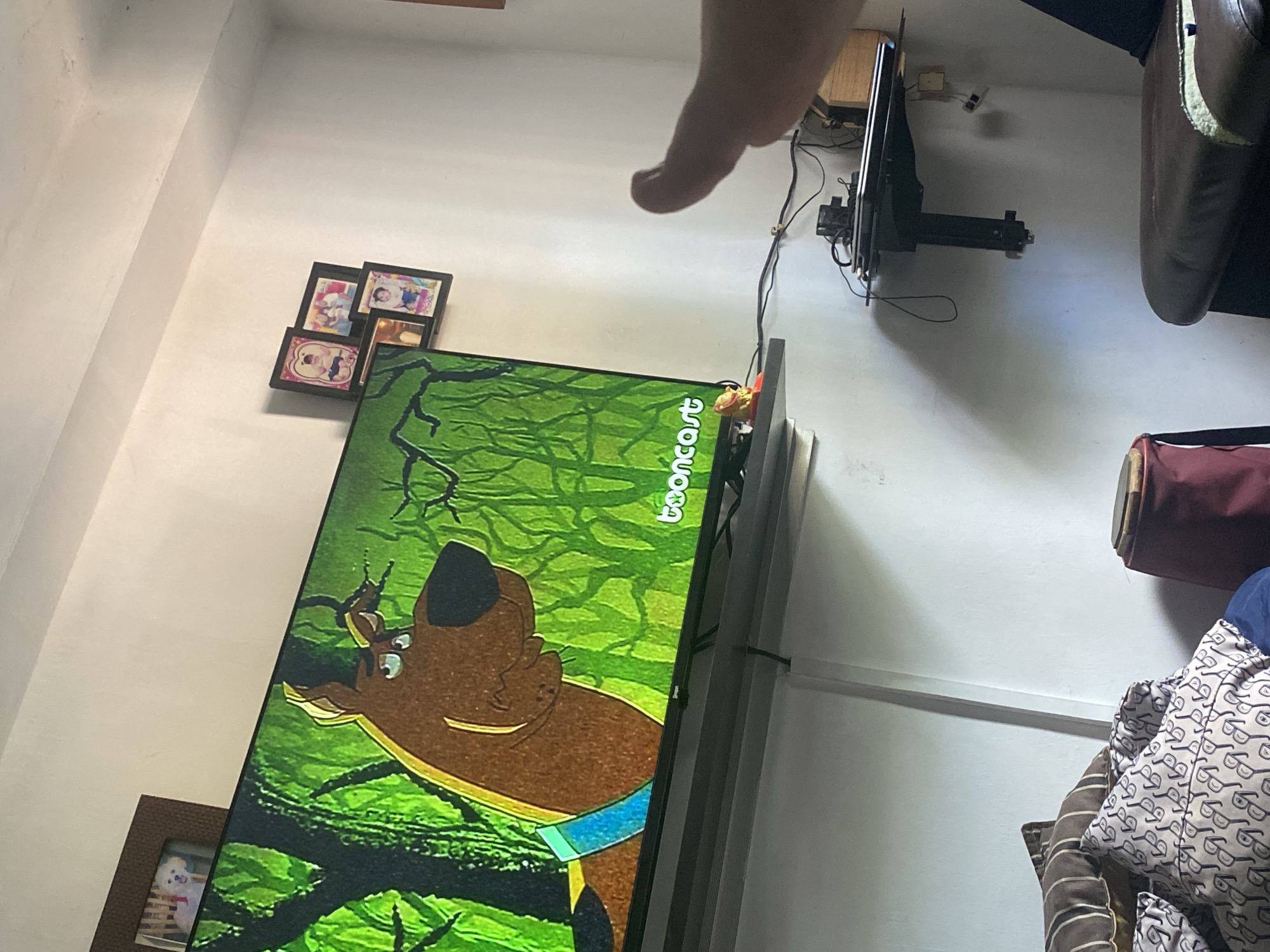 Resident watches Scooby-Doo in pajamas at home