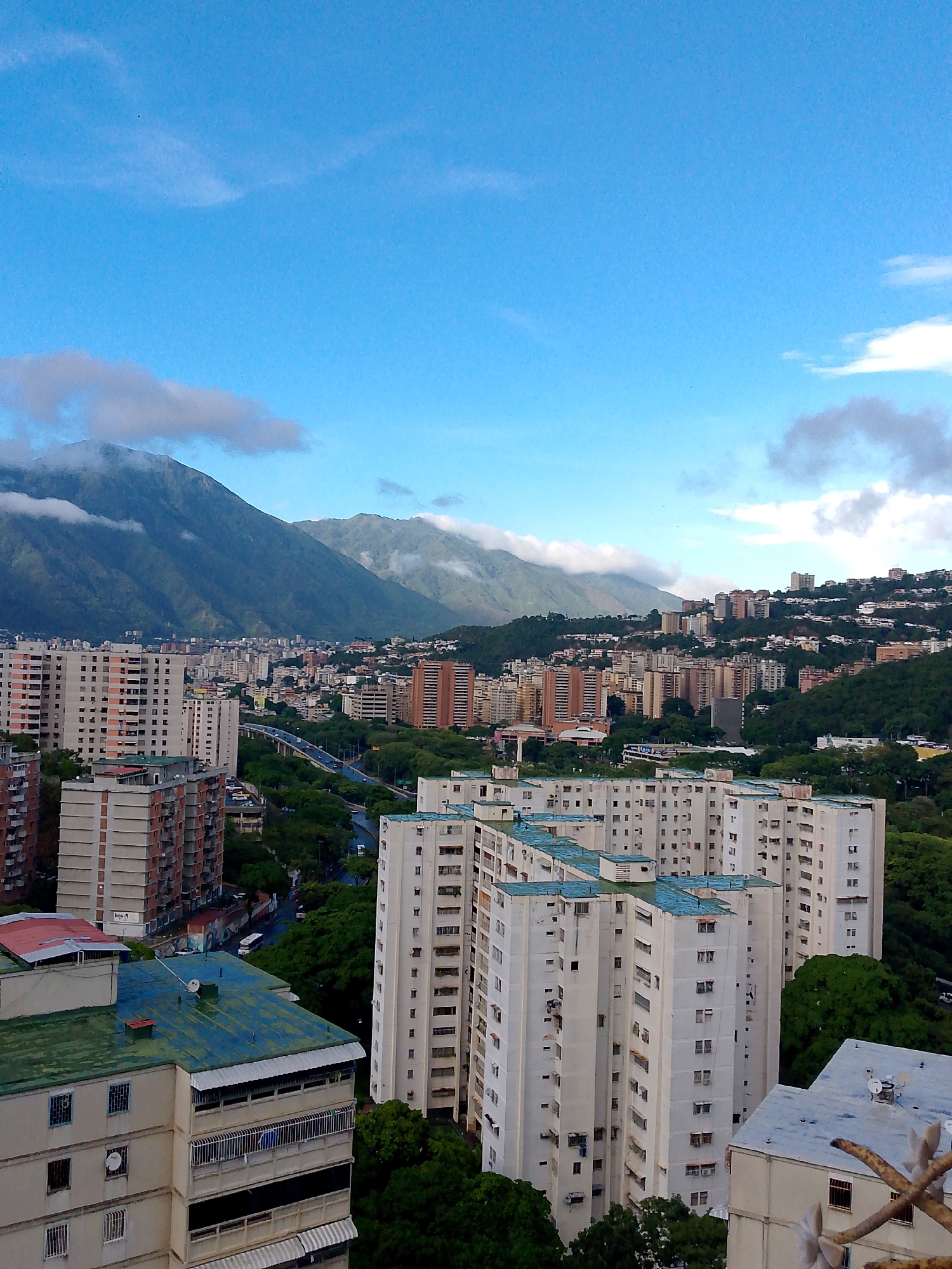 Aerial and street views of Caracas barrios after evening rain