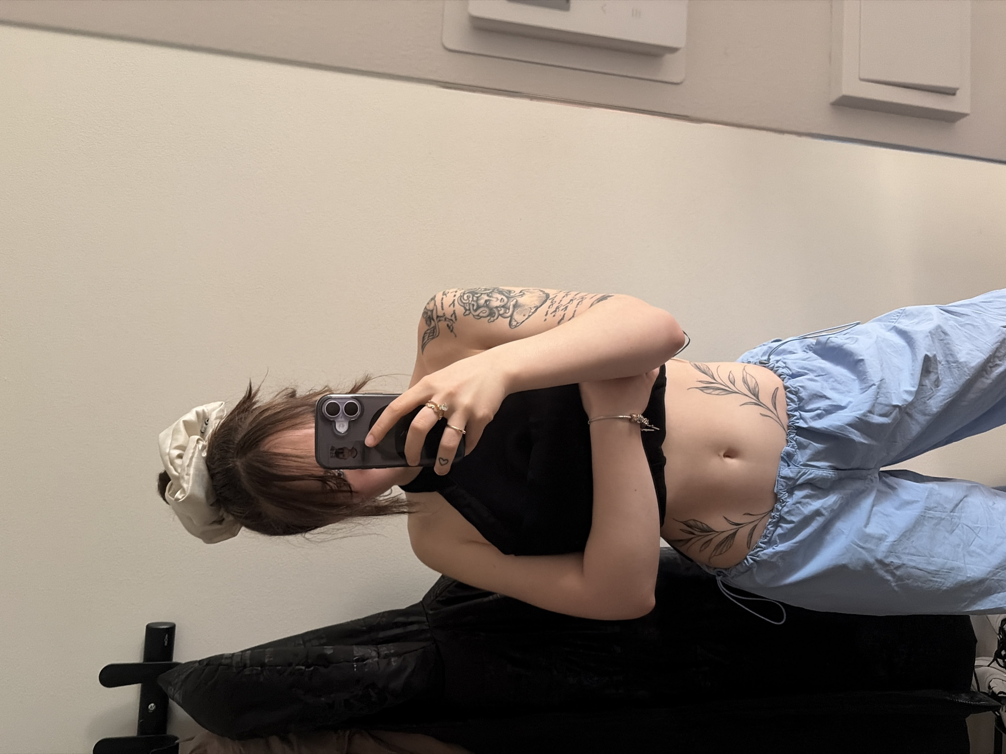 Woman styles hair, takes selfies in Vantaa bathroom