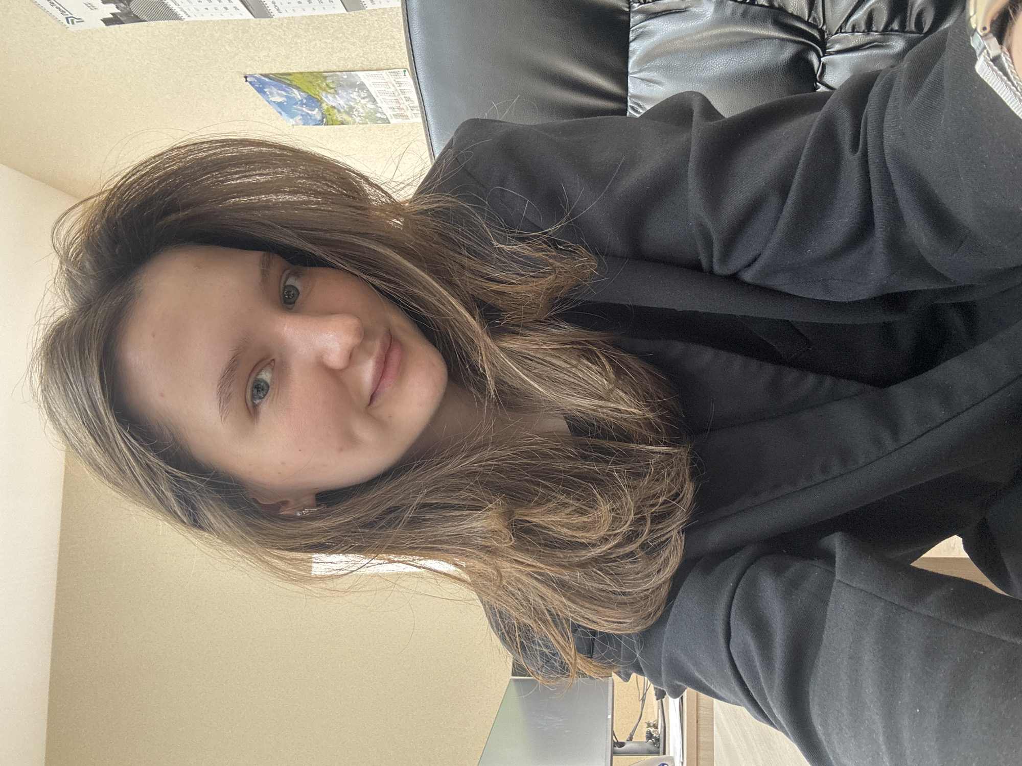 Woman takes casual selfies indoors in Perm, Russia