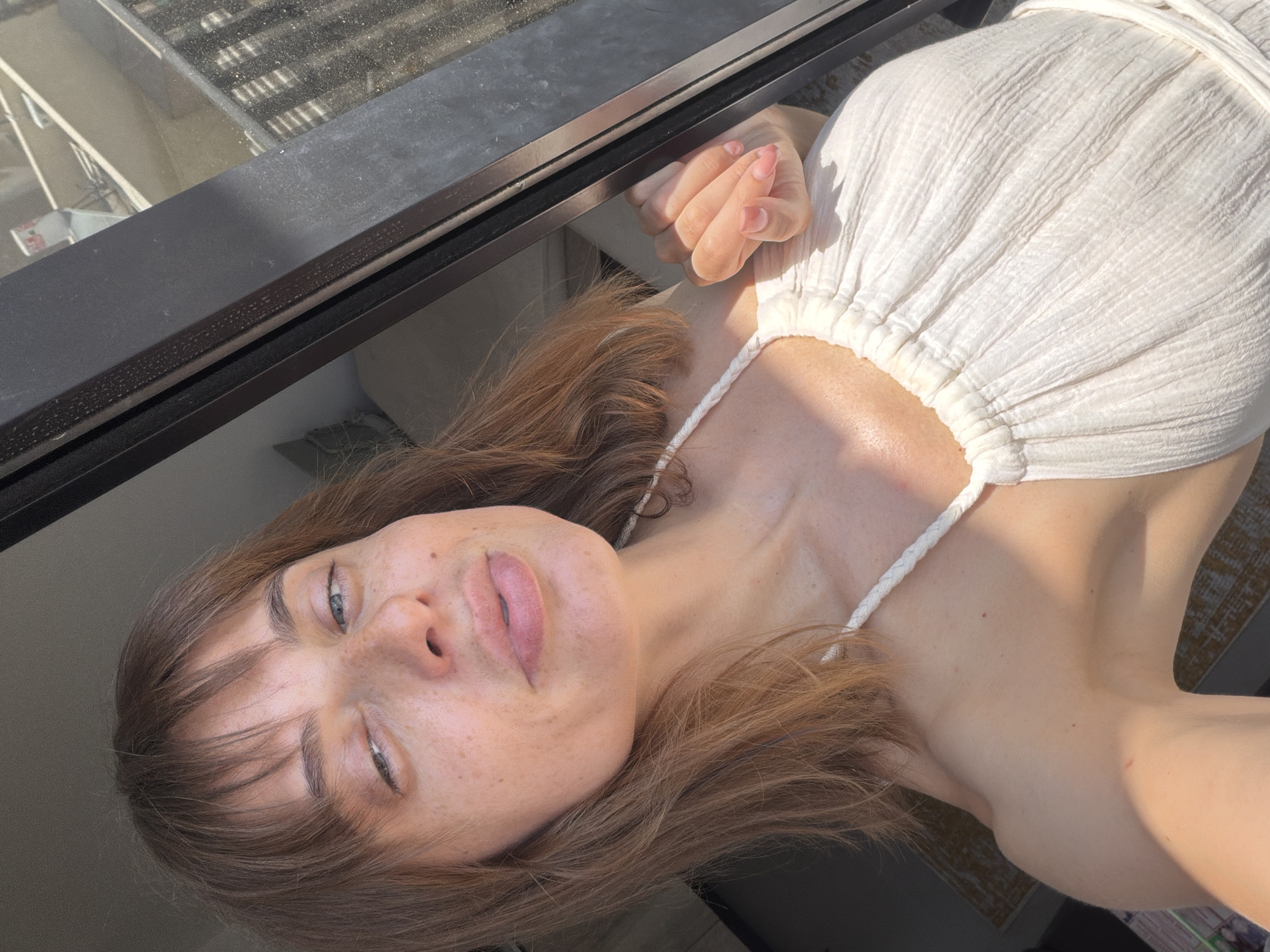 Outdoor selfie in Tel Aviv, white halter dress