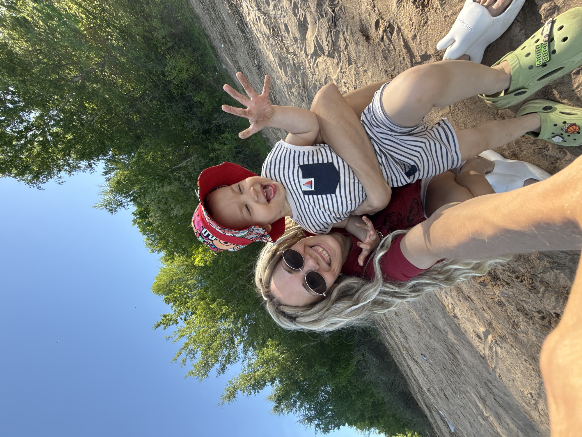Mother and child enjoy beach time in Шебунино, Russia