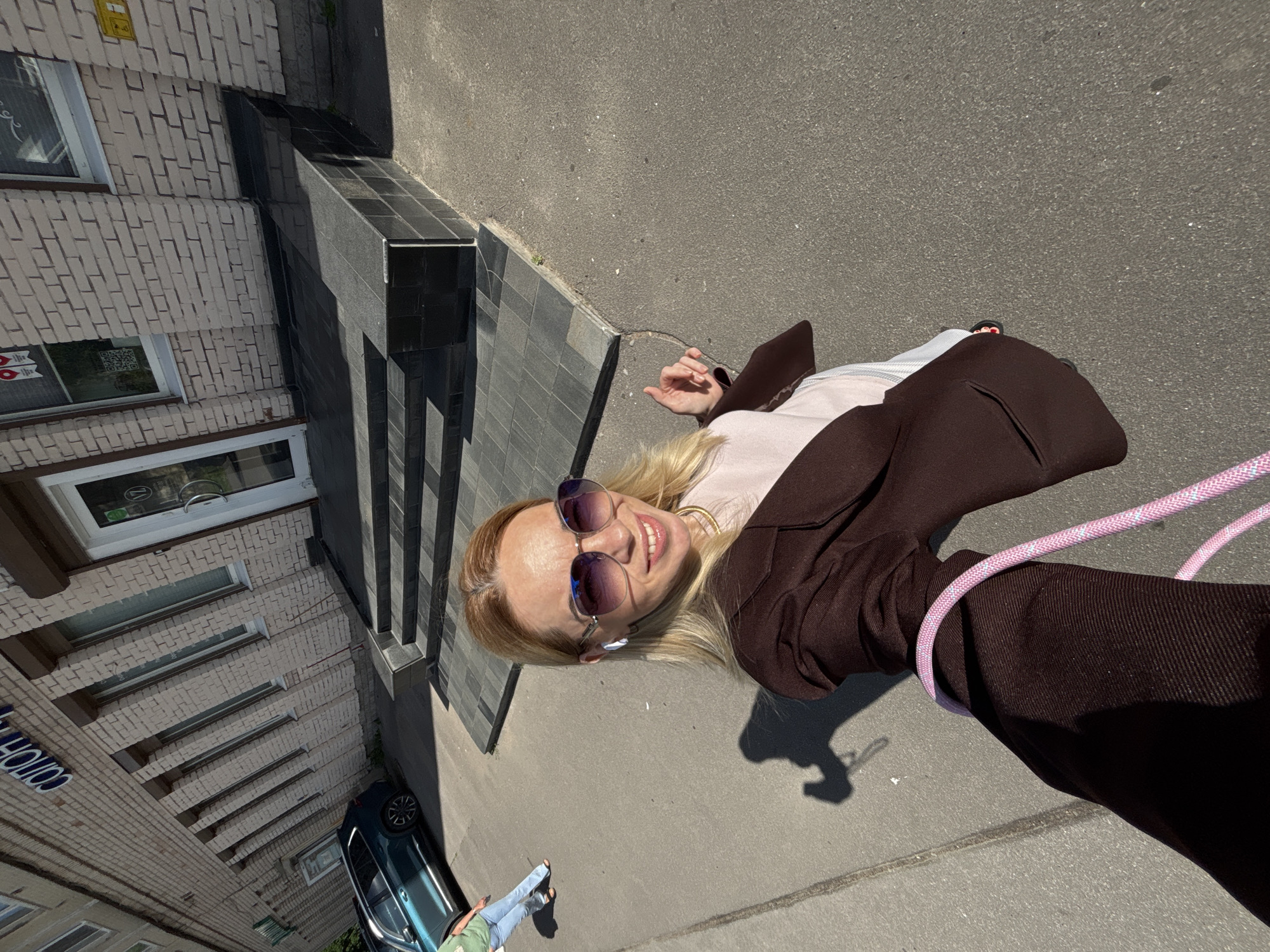 Selfie session outside a brick building in Sinyavino