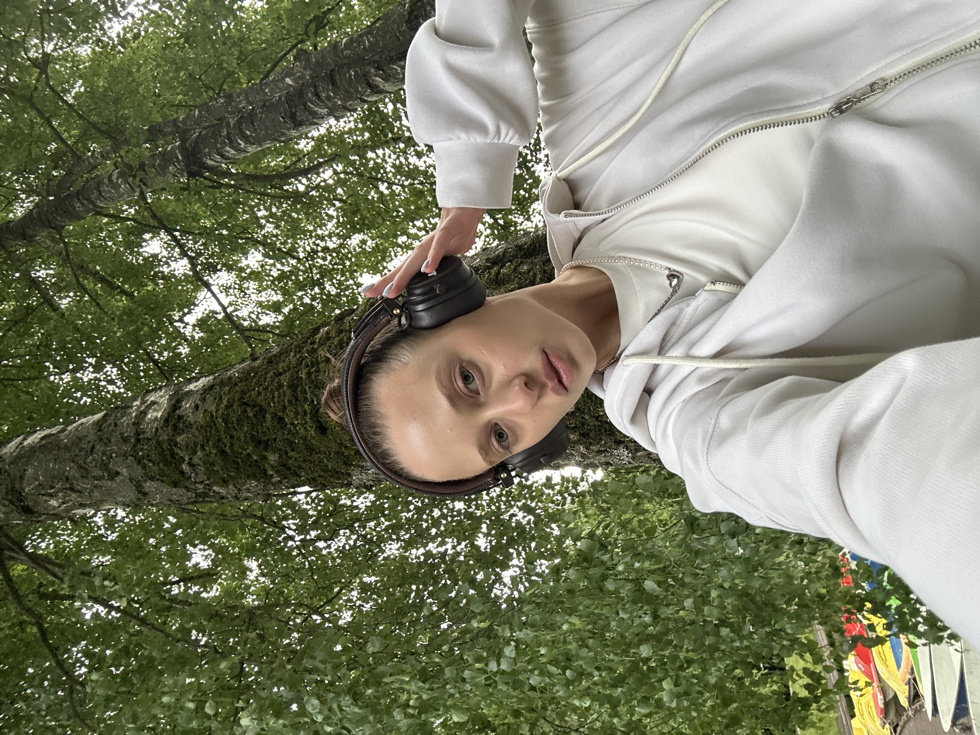 Quiet moment by a tree in Krasnogorsk, headphones on