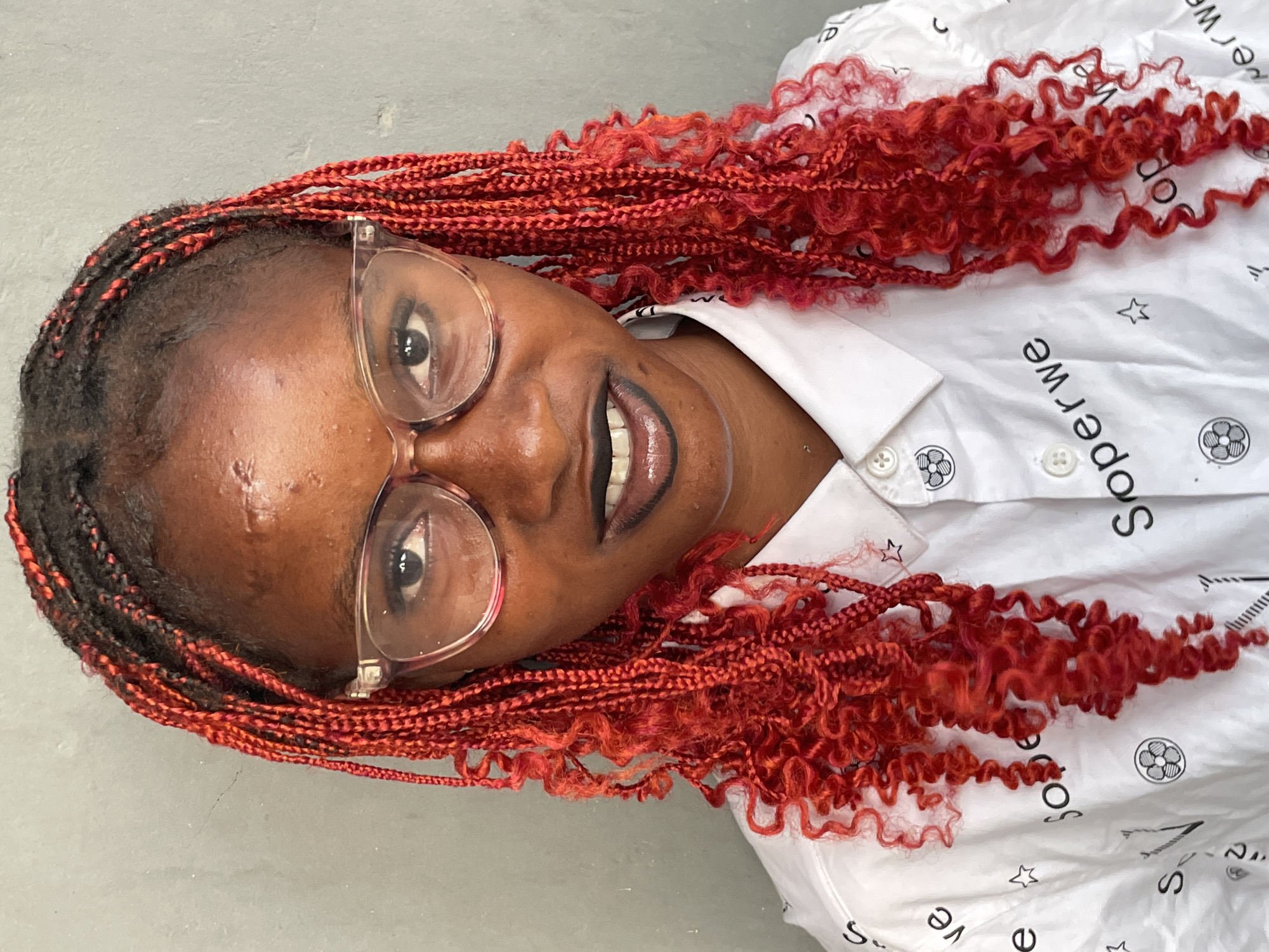 Portrait session captured in Badagry featuring woman with red braids