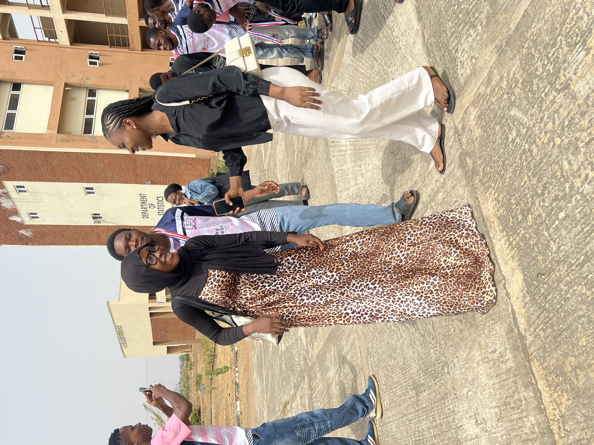 Groups gather, take photos outside Statistics Department in Minna
