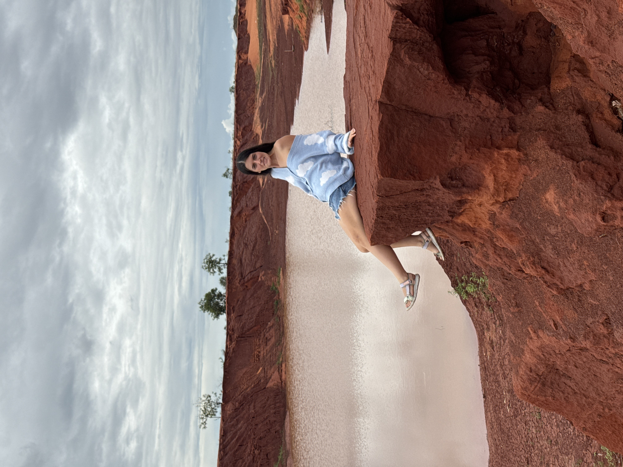 Tourist visits red rock formations at Mui Ne, Vietnam