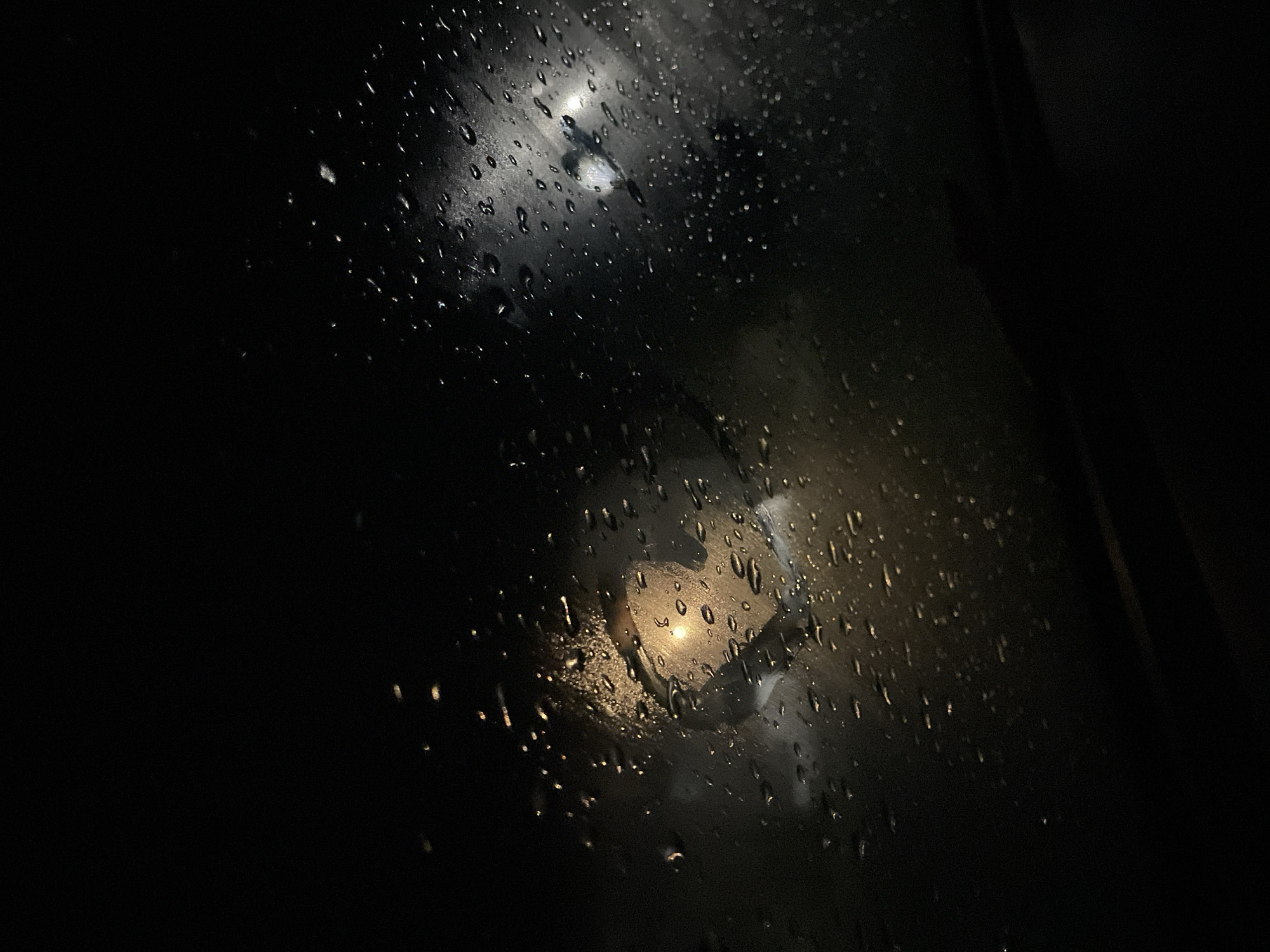 Two women document rainy car journey through Debelt, Bulgaria