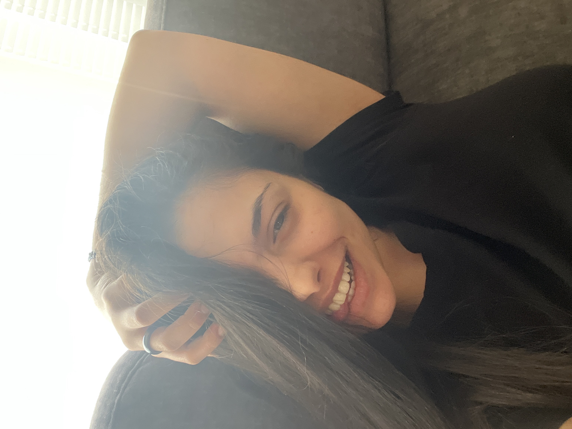 Woman relaxes on couch in Sofia apartment