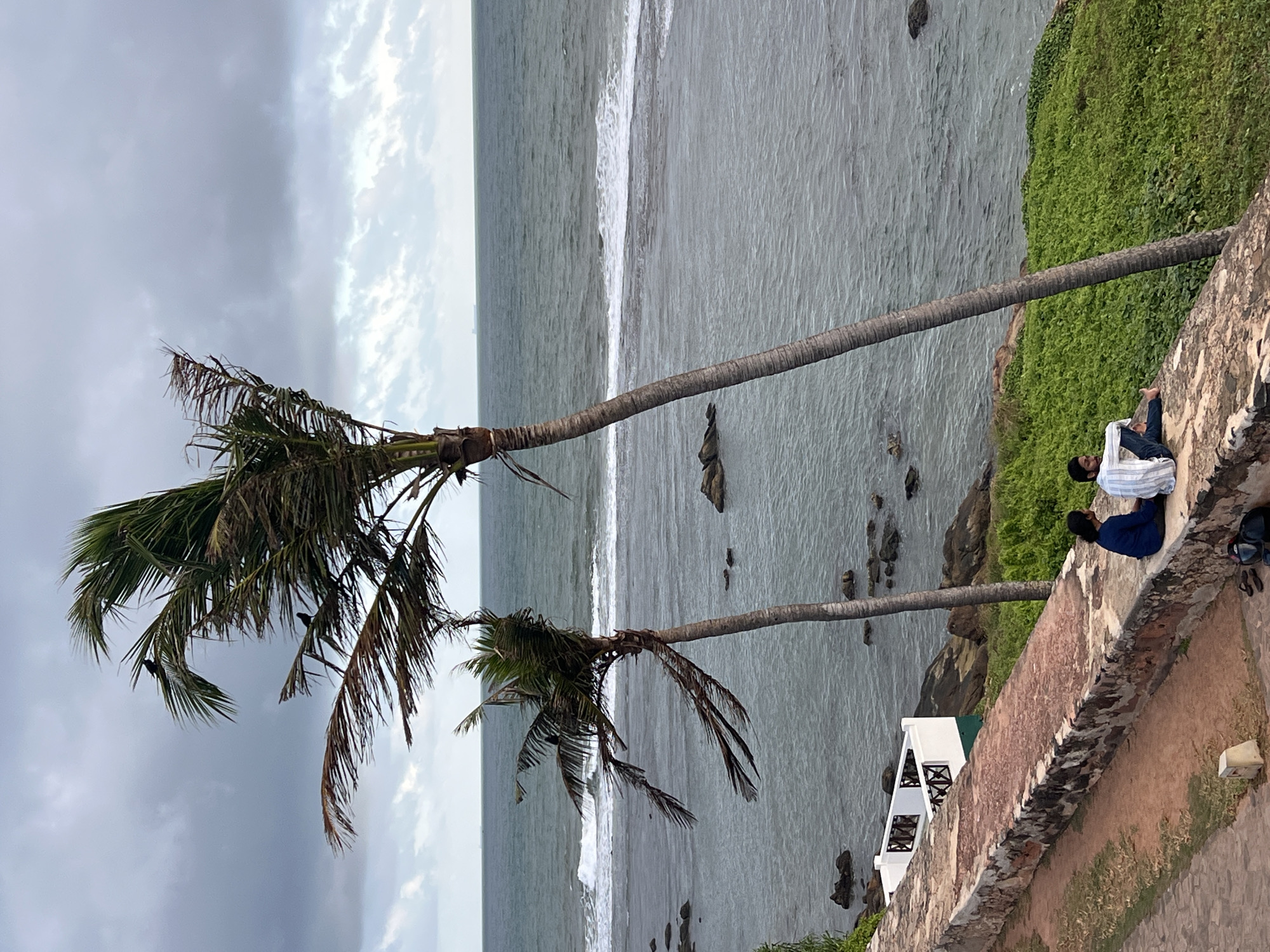 Galle Fort's ramparts and coastline on a dramatic cloudy morning
