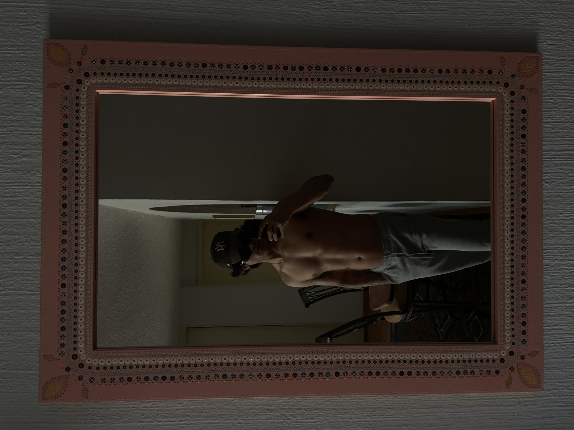 Mirror selfie captured in Mexico City showing ornate pink frame