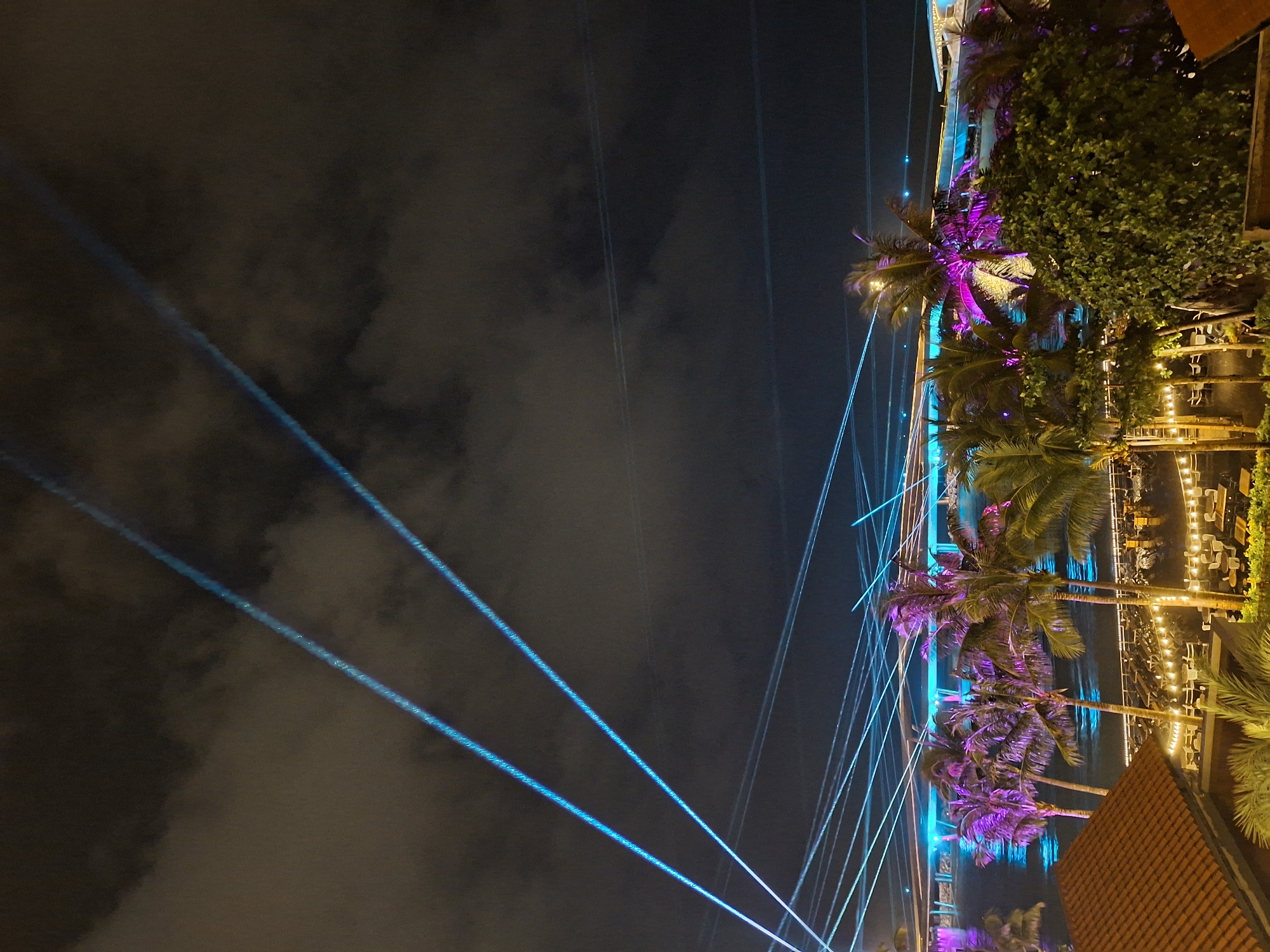 Laser lights and string lights at Phú Quốc's Sunset Sanato Beach Club