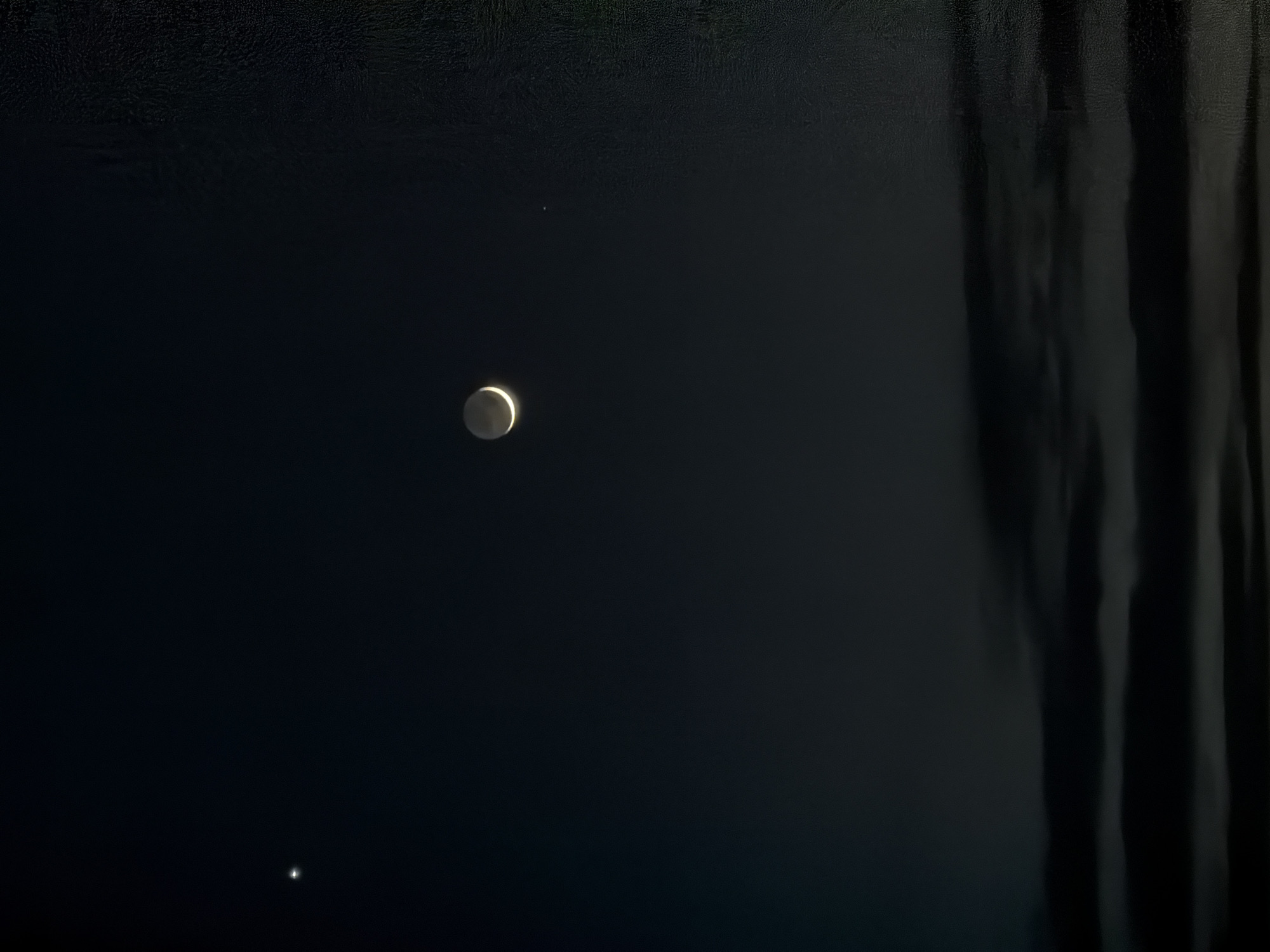 Crescent moon and Venus observed in night sky over Bulgaria