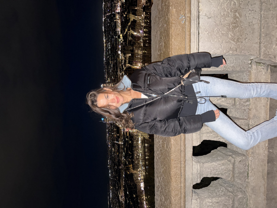 Woman enjoys evening sightseeing and dining in Lyon, France