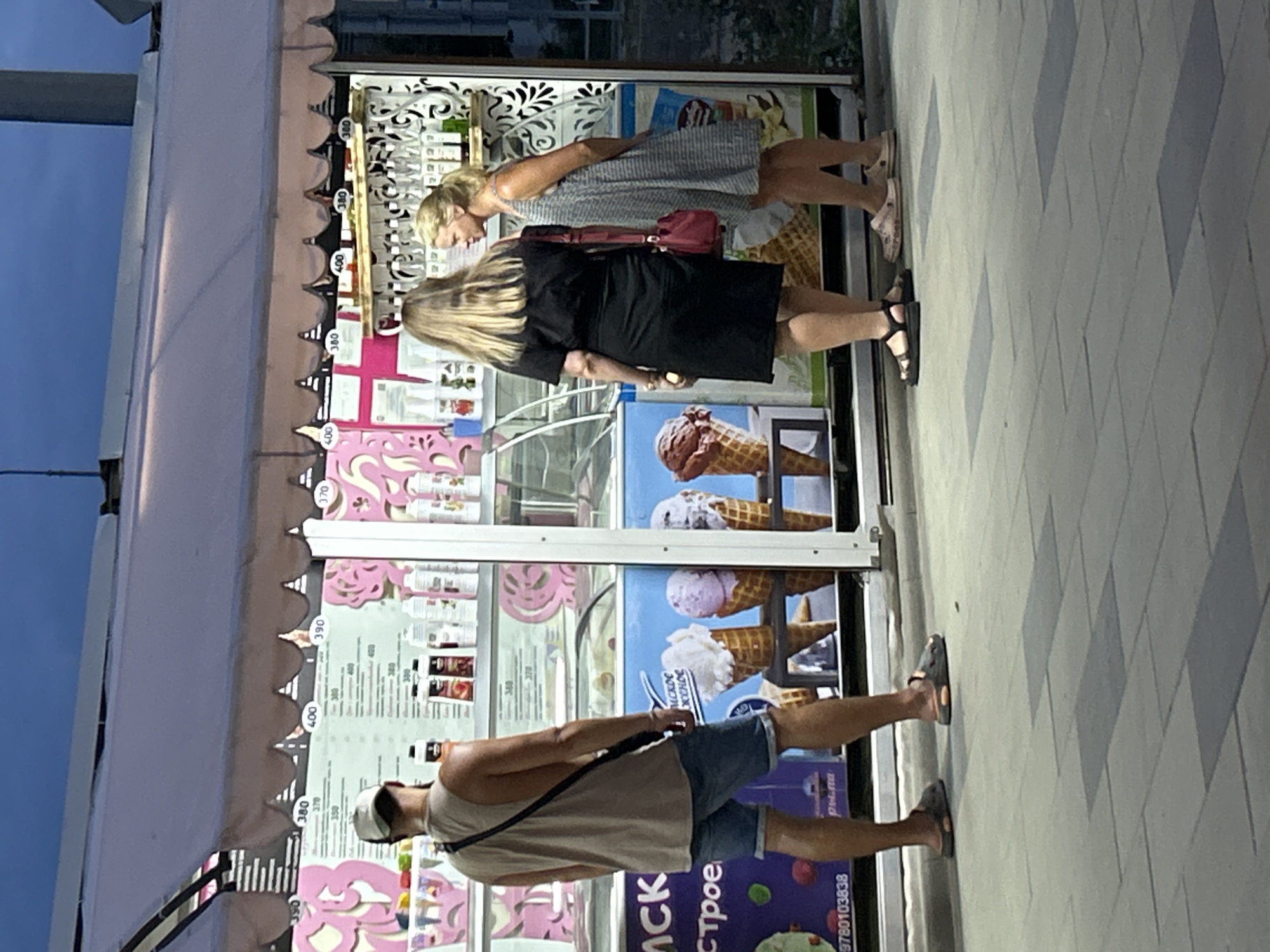 Summer evening stroll along Shchyolkino's promenade, cats and ice cream included