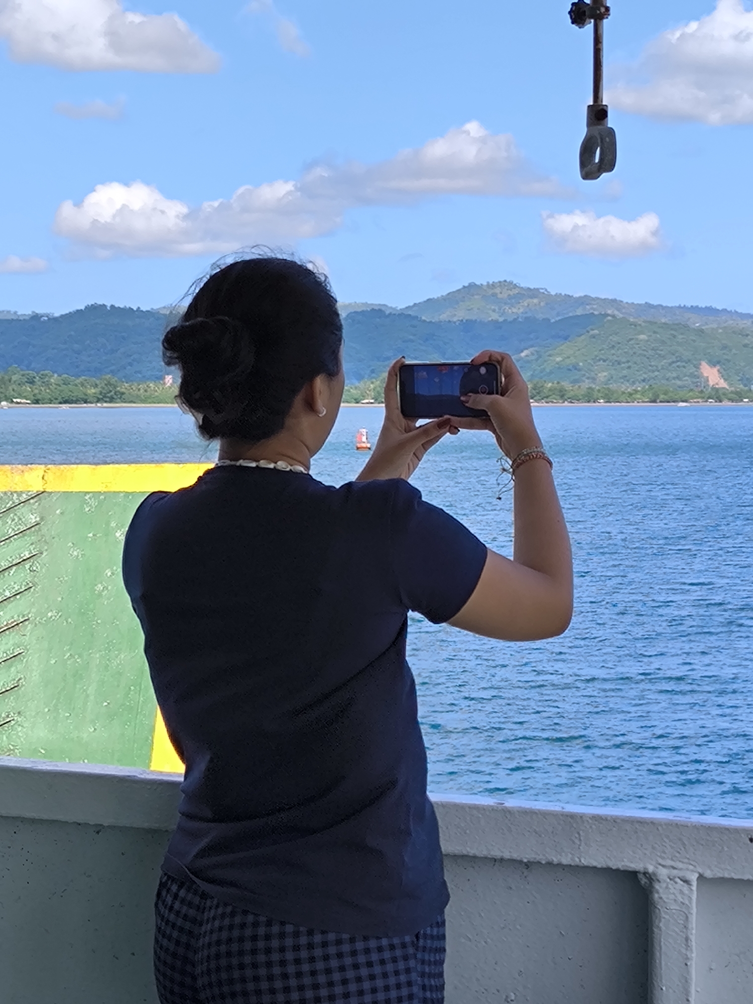 Ferry passengers capture routine maritime journey near Indonesian coastline