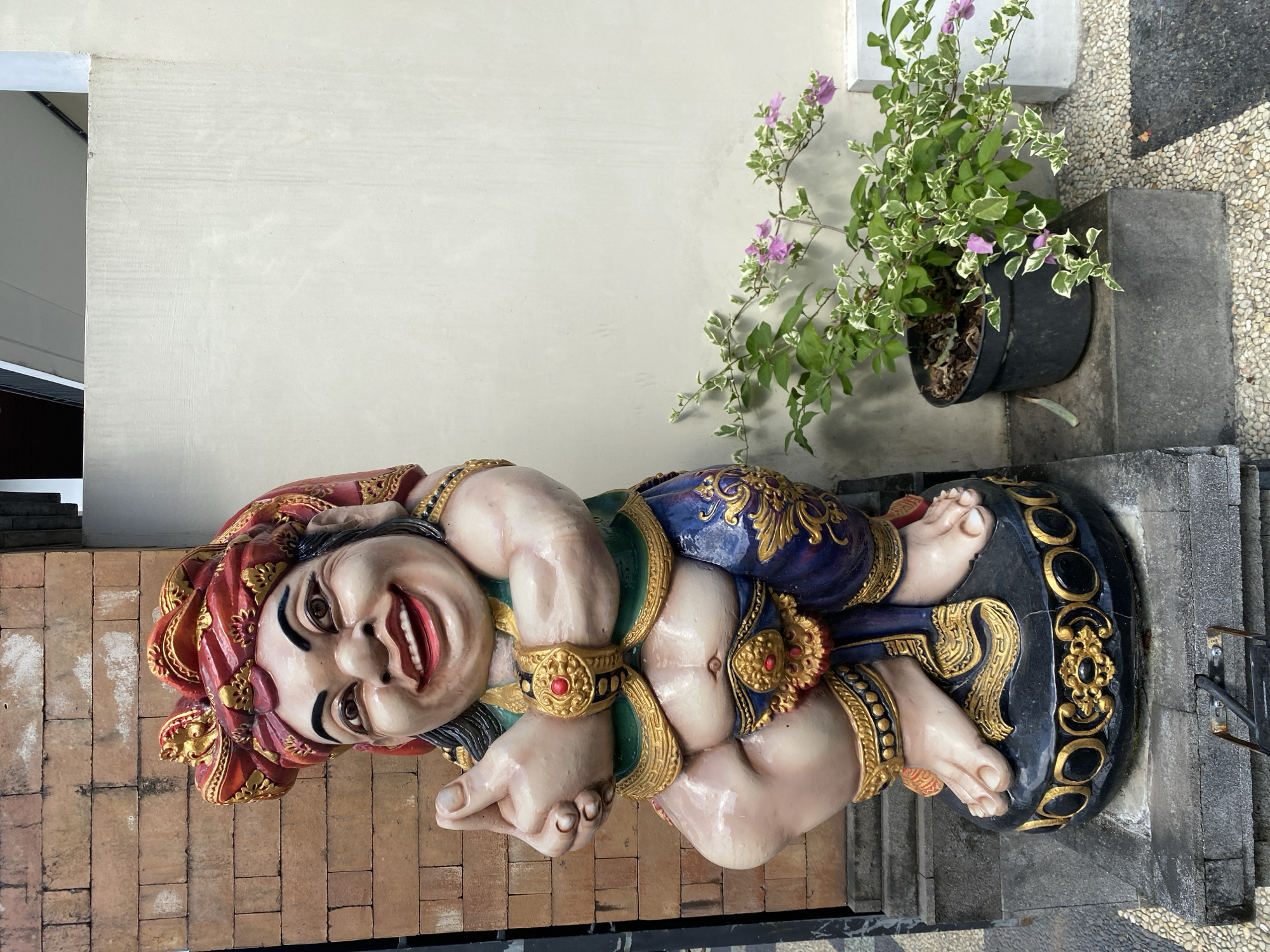 Indoor scenes with decorative statue and desk setup documented