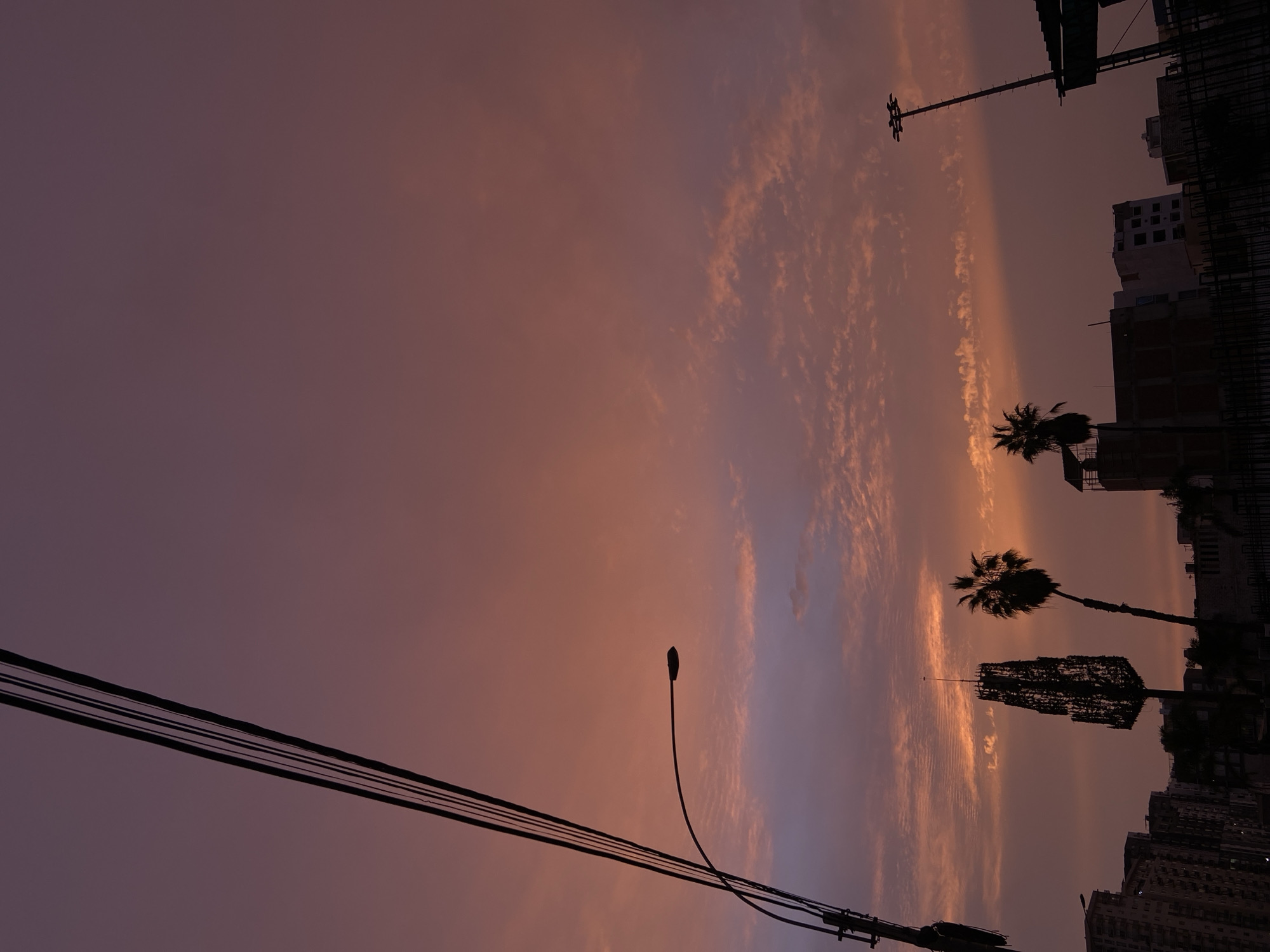 Colorful sunset observed over urban San Miguel, Peru
