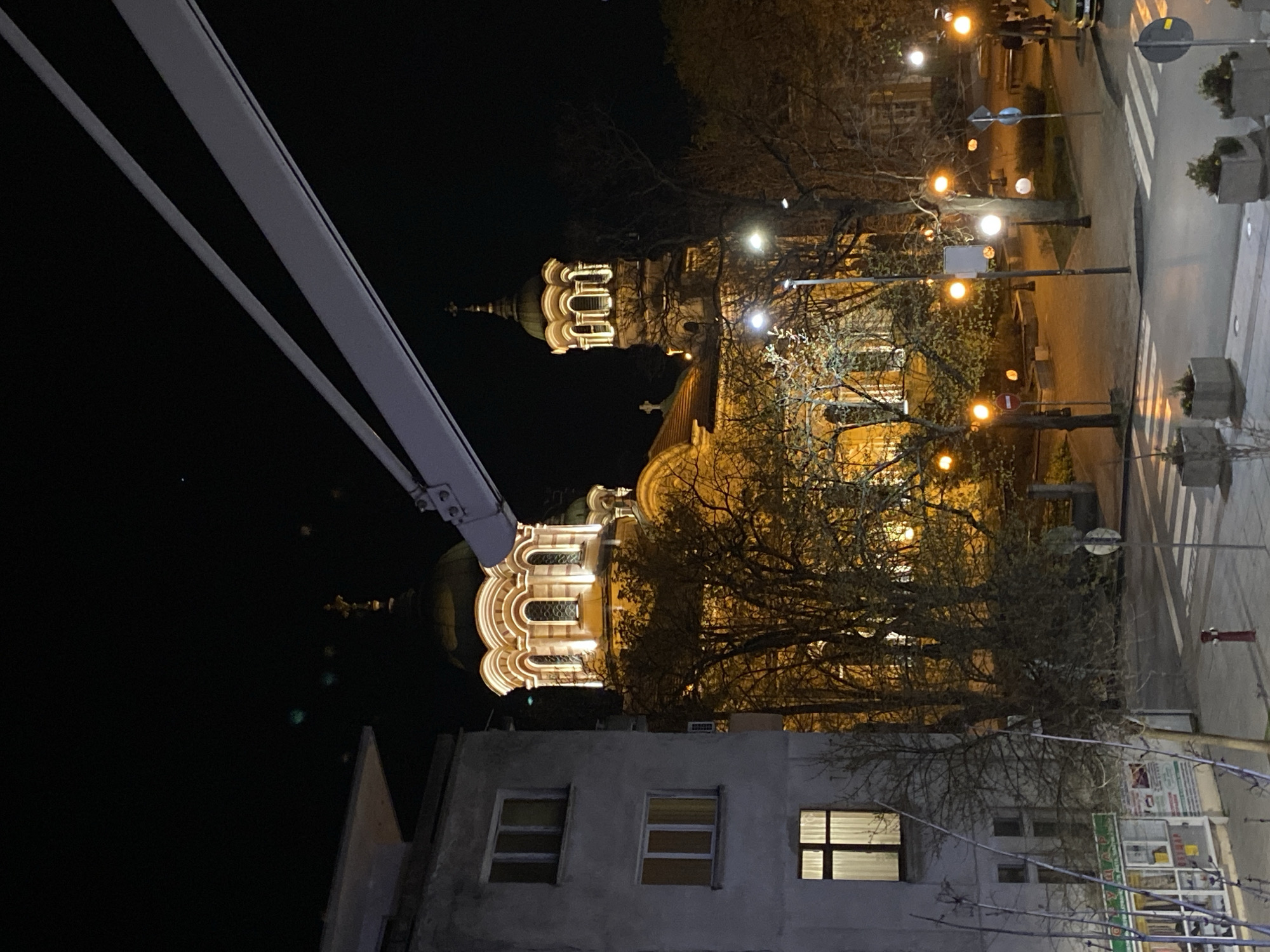 Evening social gathering near illuminated church in Stara Zagora