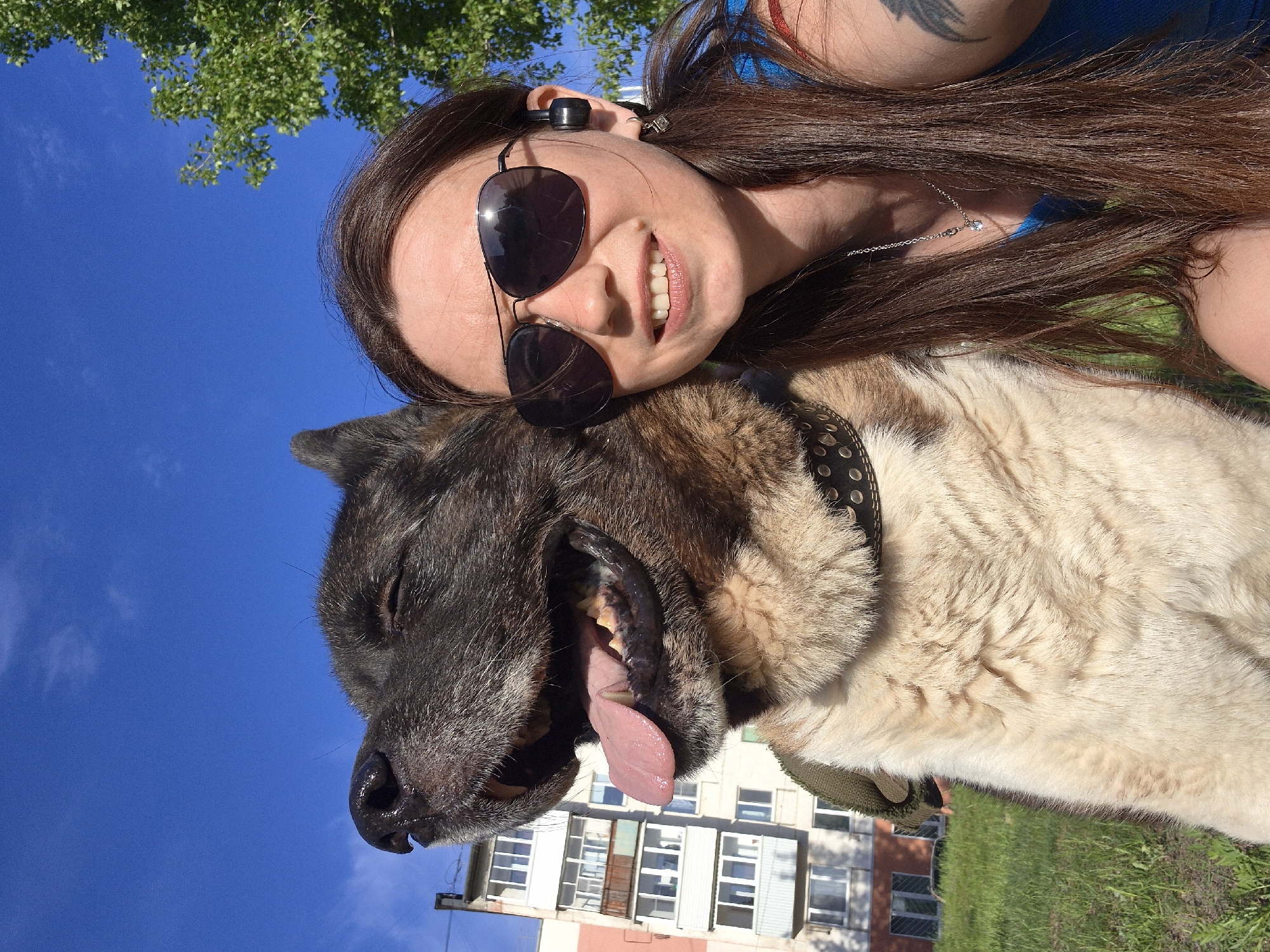 Woman and dog enjoy sunny afternoon in Russian neighborhood