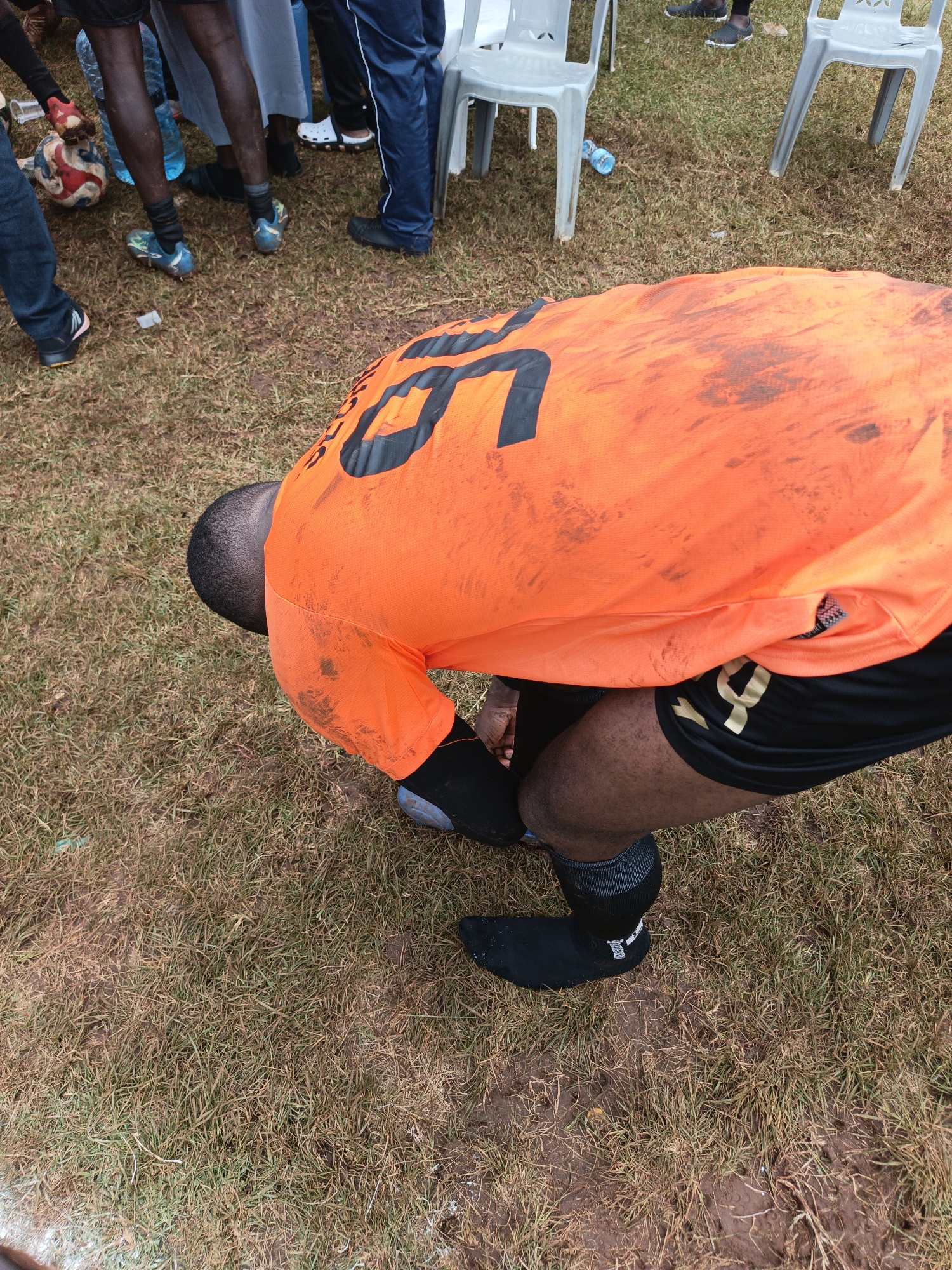 Soccer match draws spectators to grassy field in Nairobi