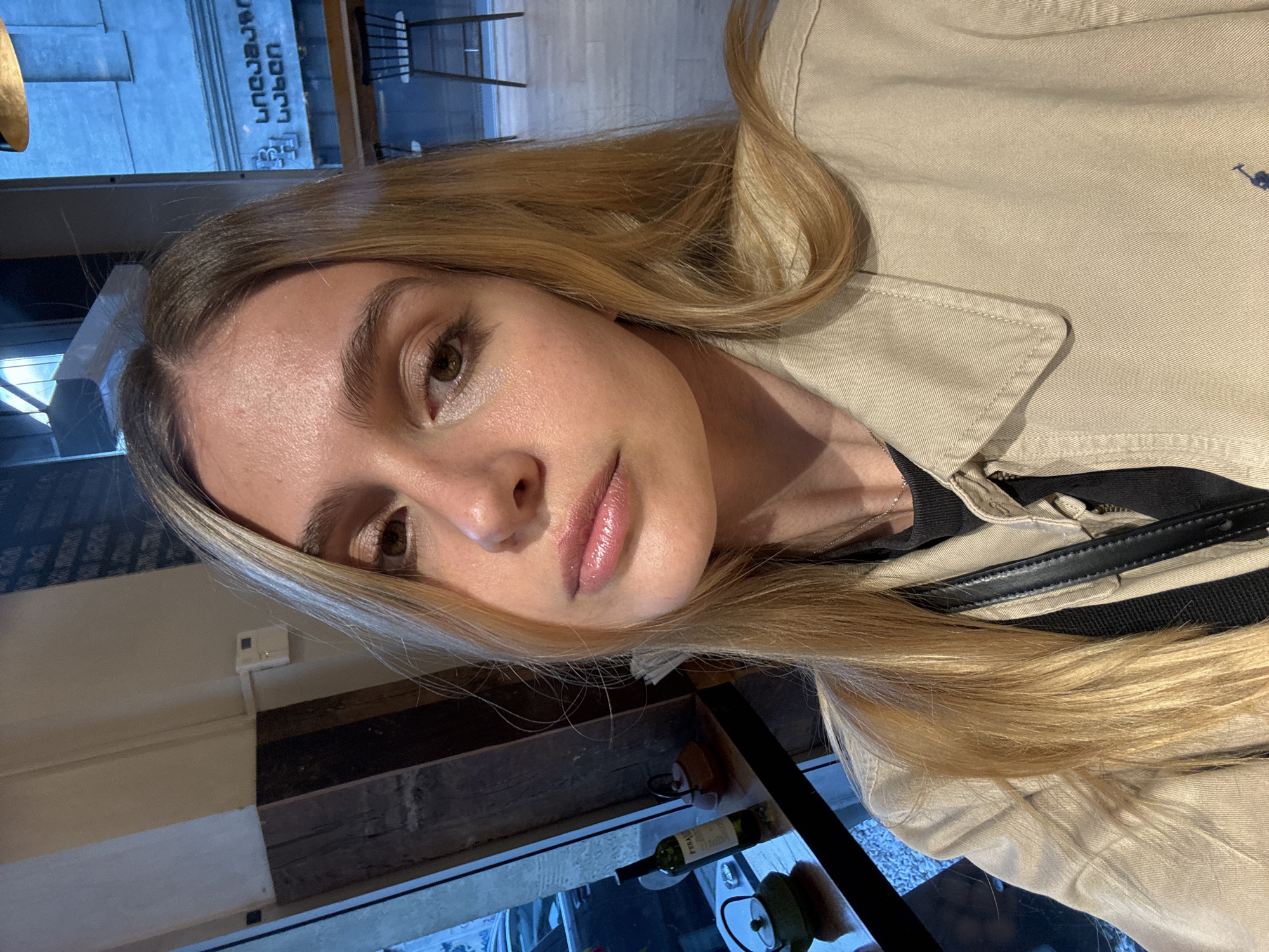 Woman takes selfie at Tbilisi cafe serving baguette sandwiches