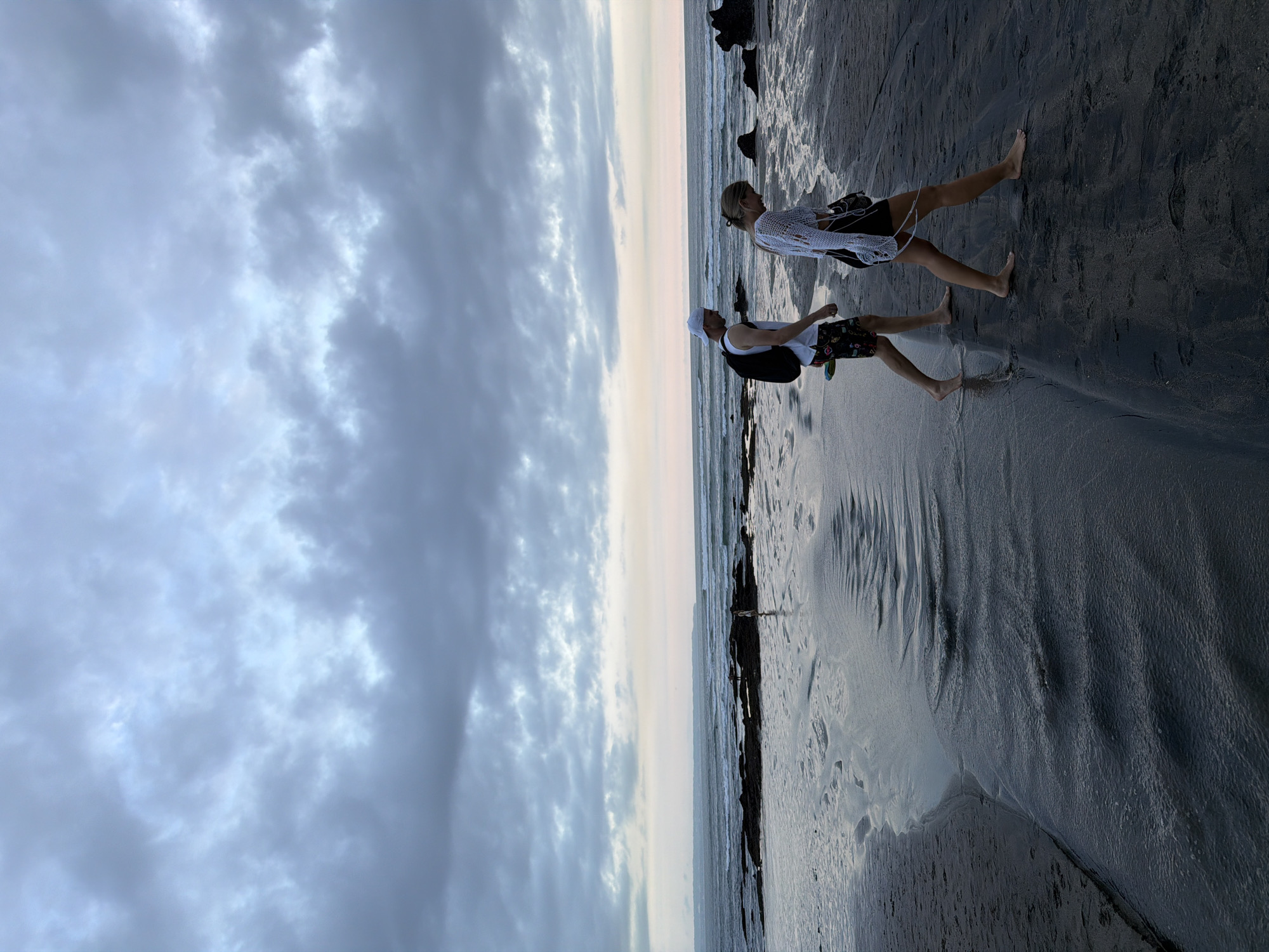 Wedding photoshoot captured on North Kuta beach under overcast skies