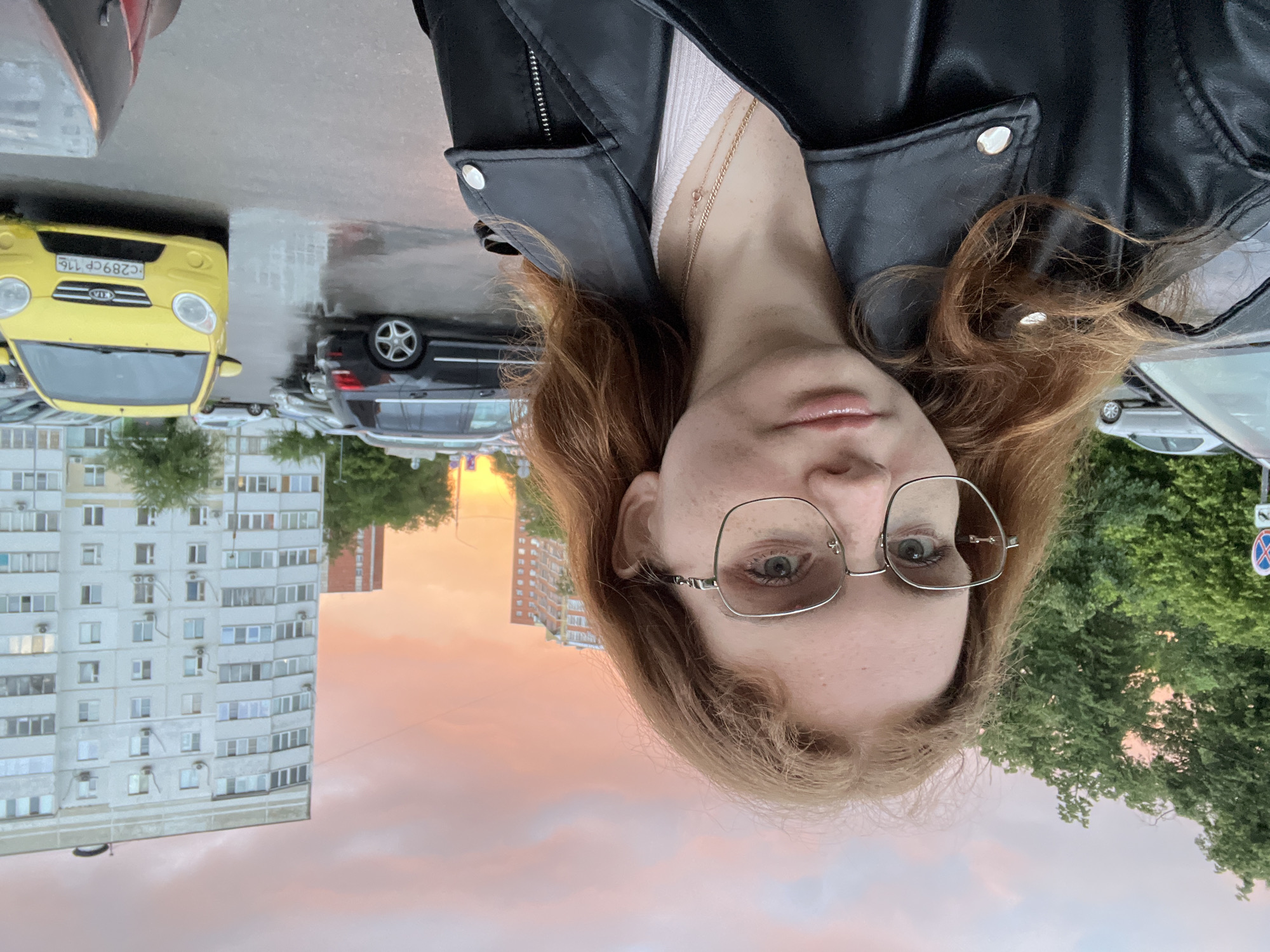 Woman documents dramatic sunset selfies in Kazan residential area