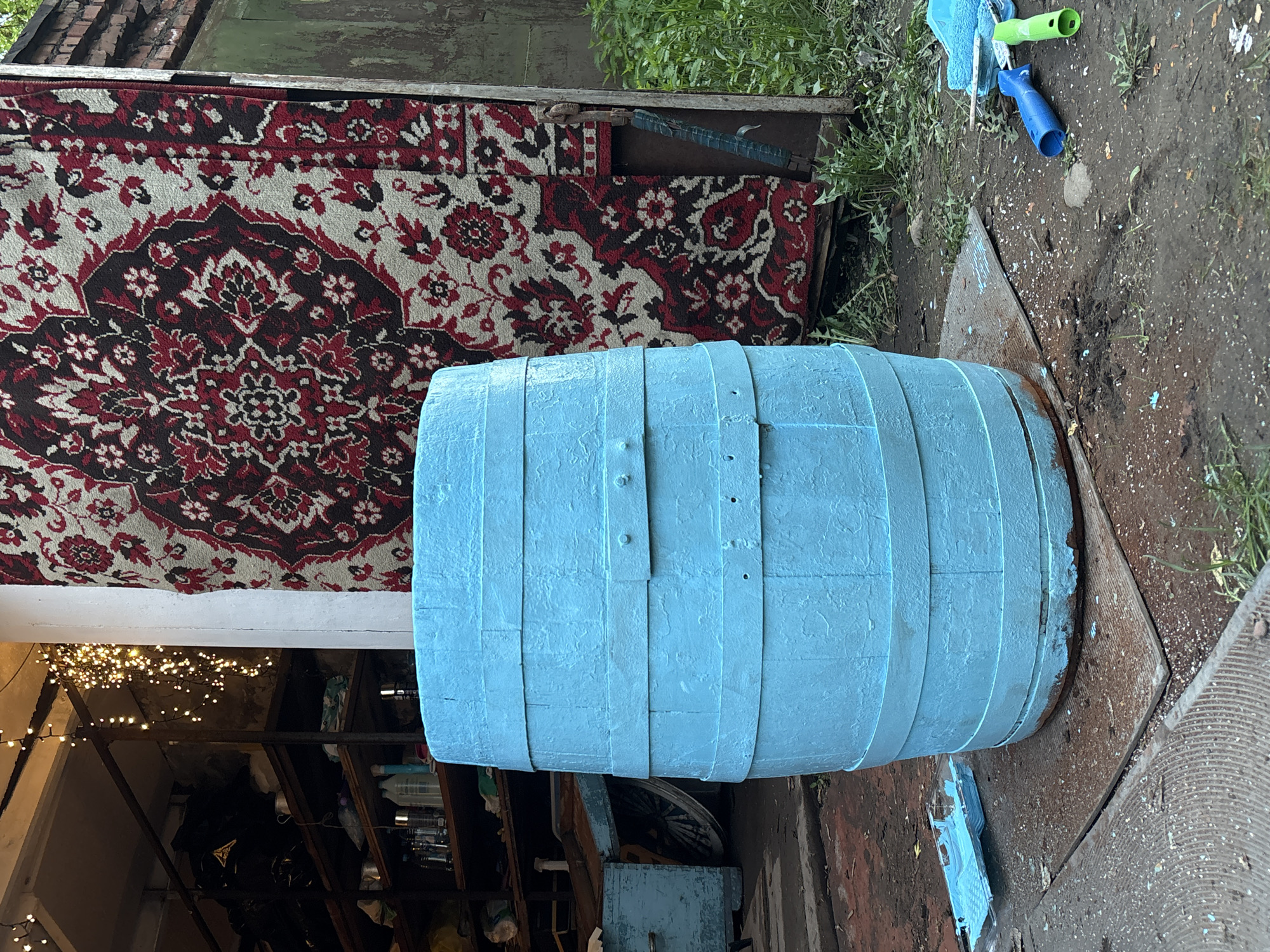Wooden barrel spotted outdoors in Krasnoyarsk yard setting