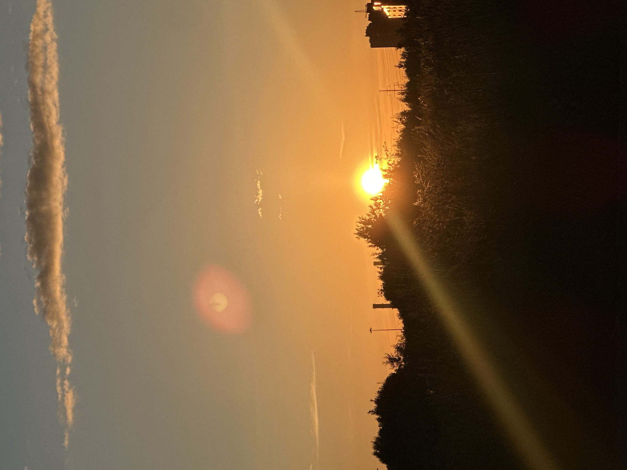 Sunset at Lake Ladoga, sneakers on asphalt nearby