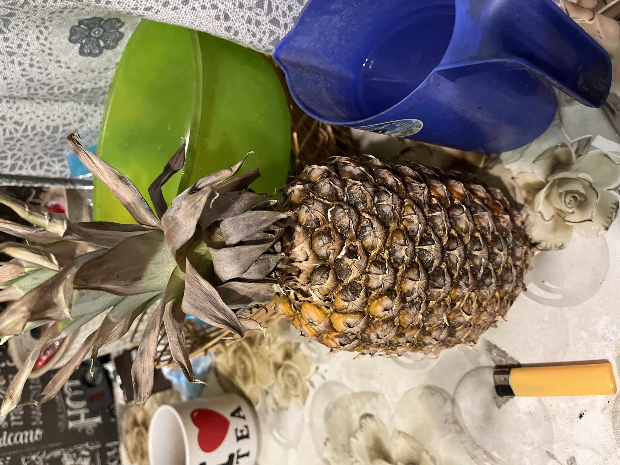 Tea time arrangement with pineapple and decorative mugs in Minsk