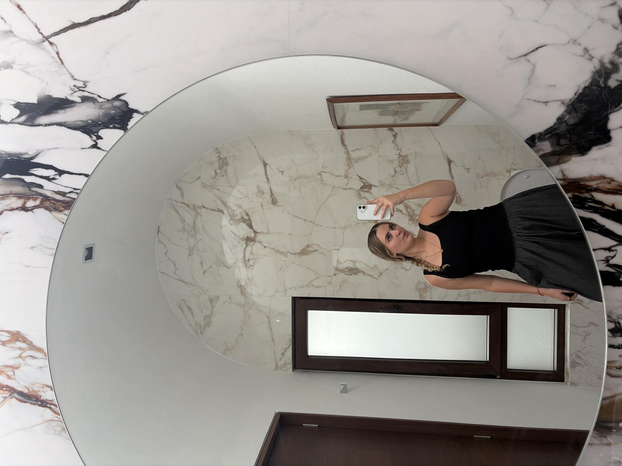 Woman takes mirror selfies in modern Mexico residence