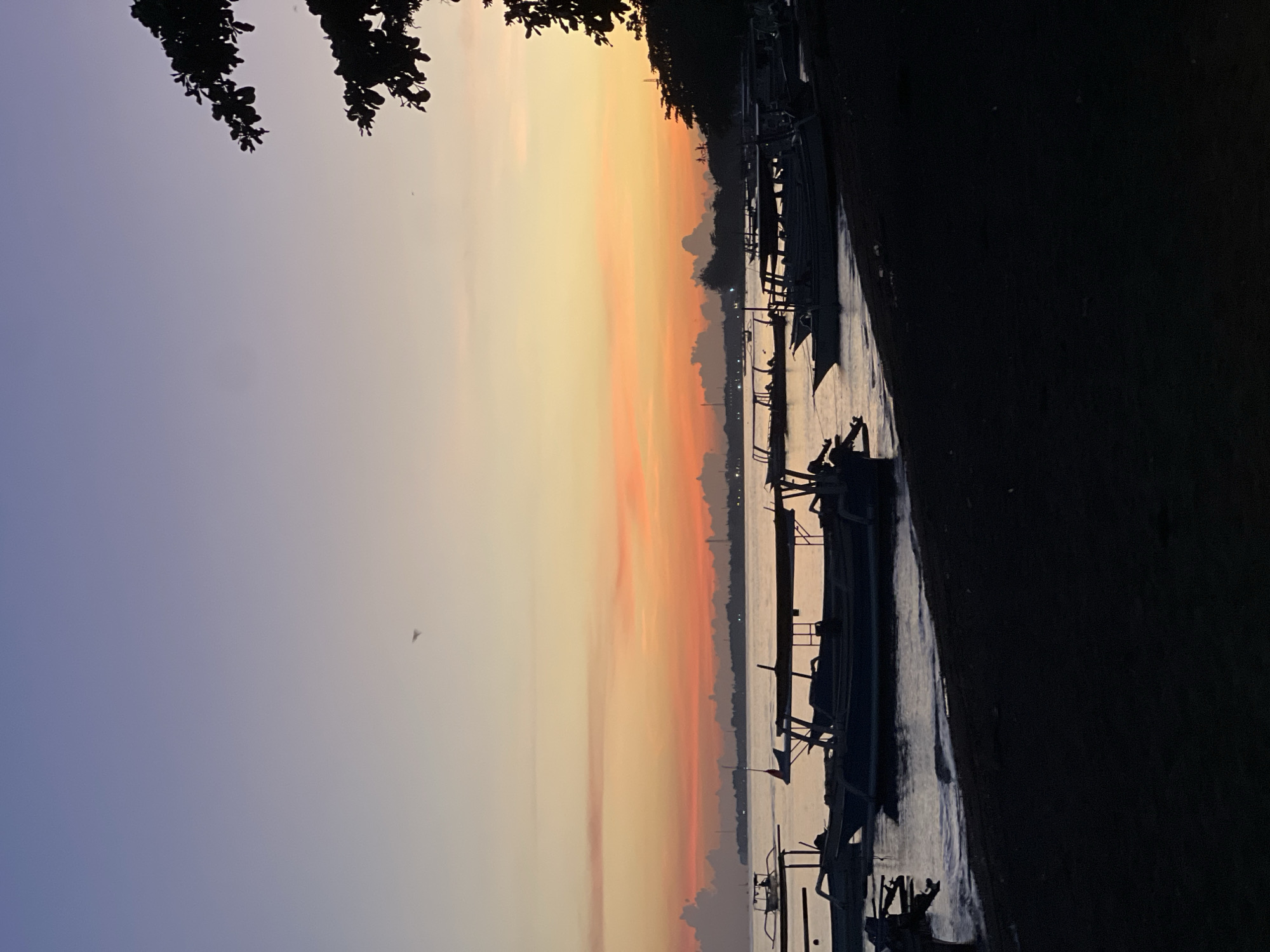 Sunset observed along Buleleng Indonesia coast with boats
