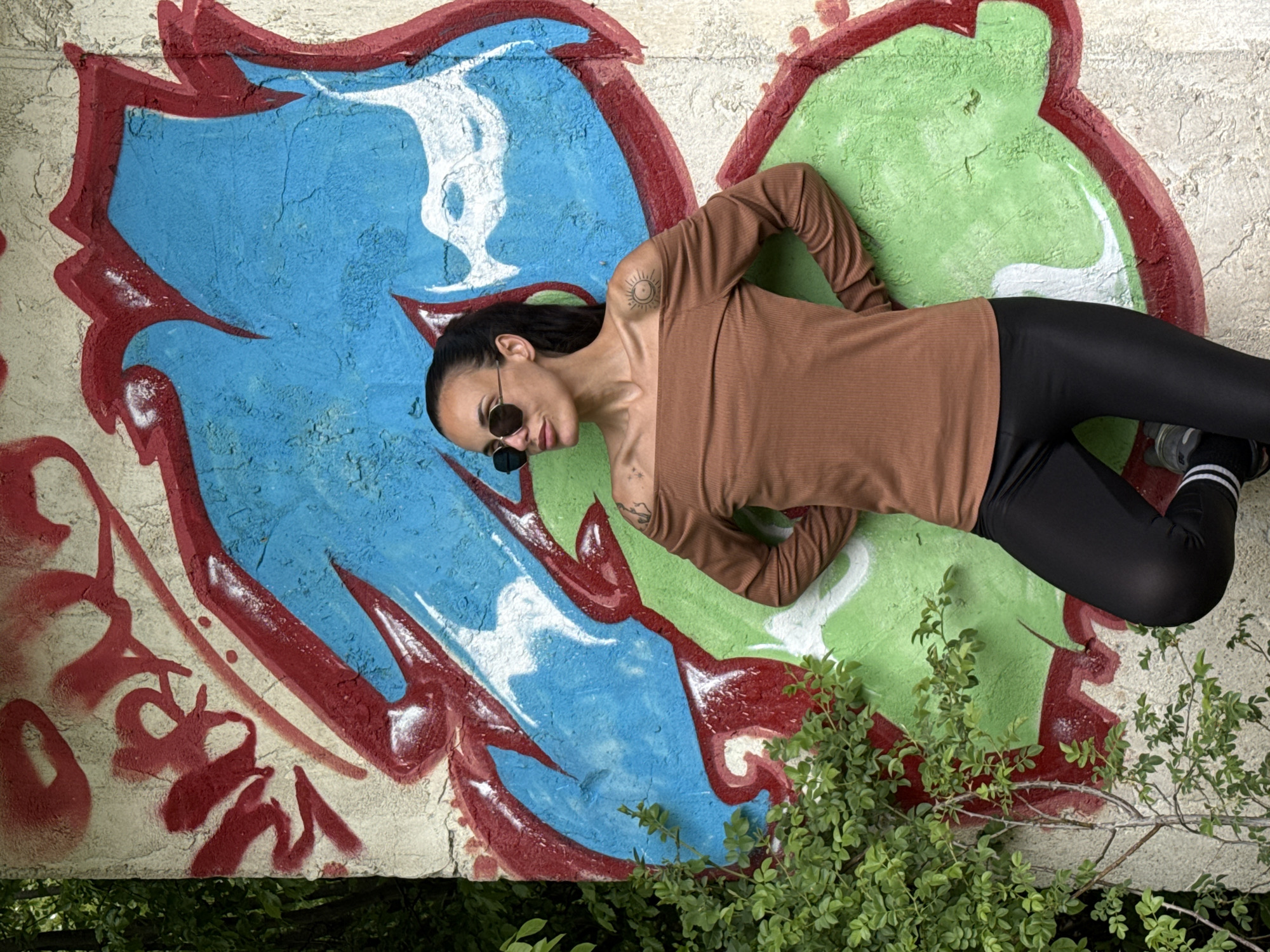 Woman conducts outdoor photoshoot across multiple Pleven locations