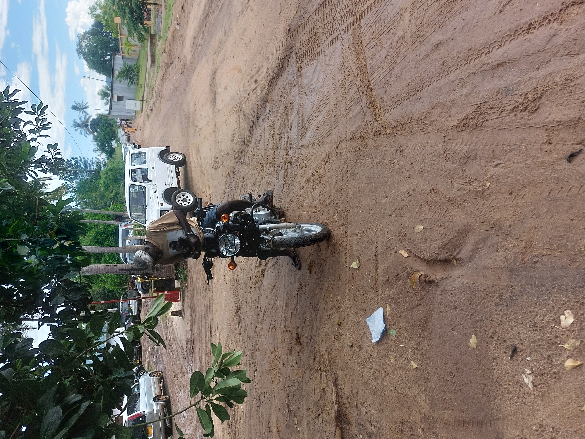 Daily life unfolds on Dar es-Salaam's muddy streets