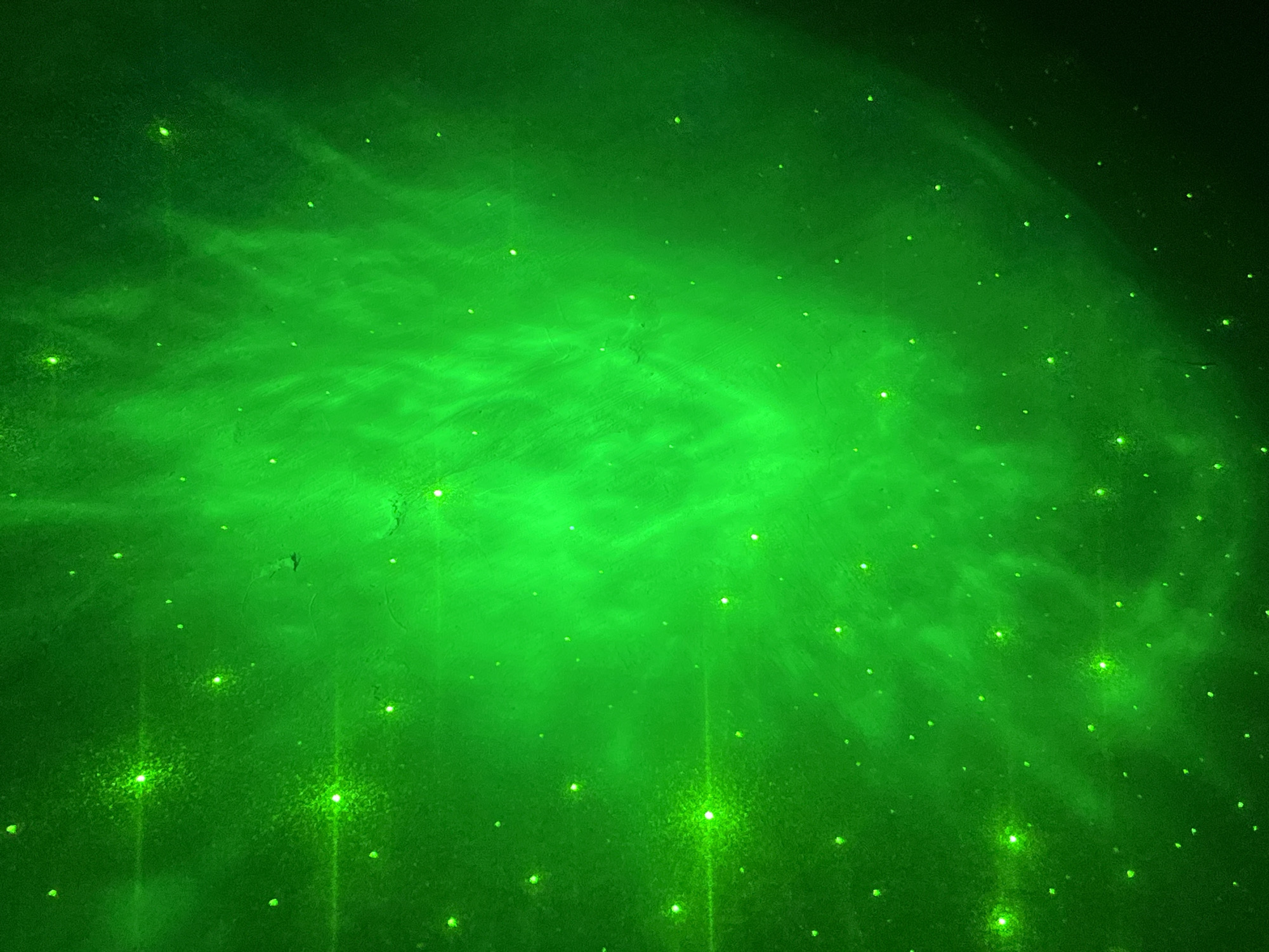 Green celestial phenomenon with light streaks observed in Nizhny Tagil