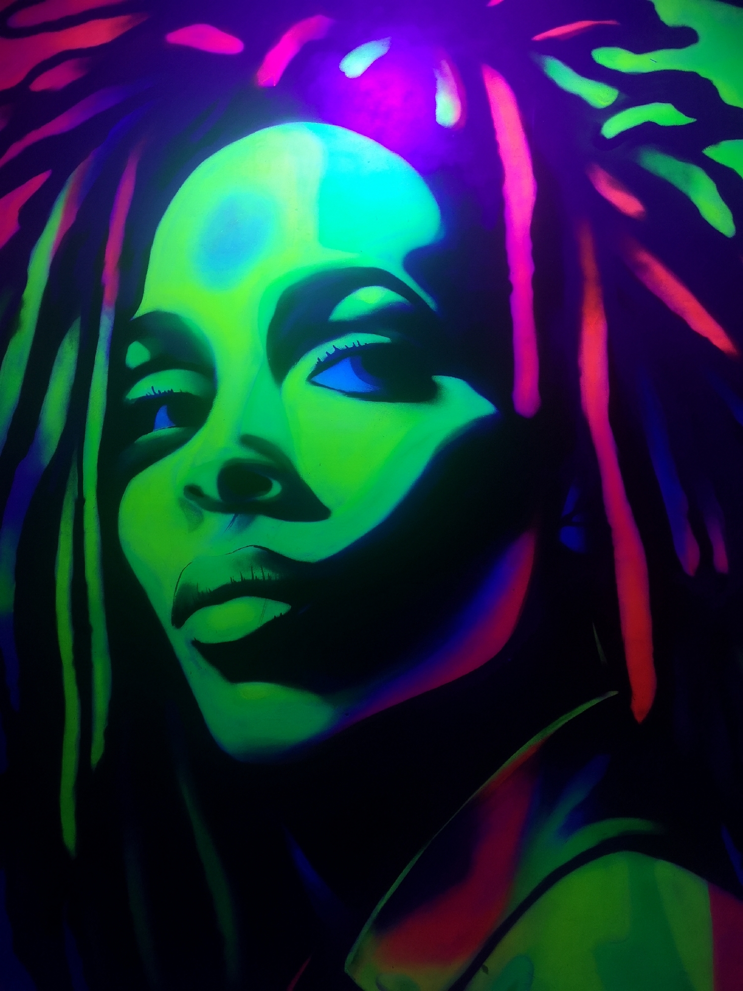 Woman photographed at neon mural in Chaikovsky, Russia