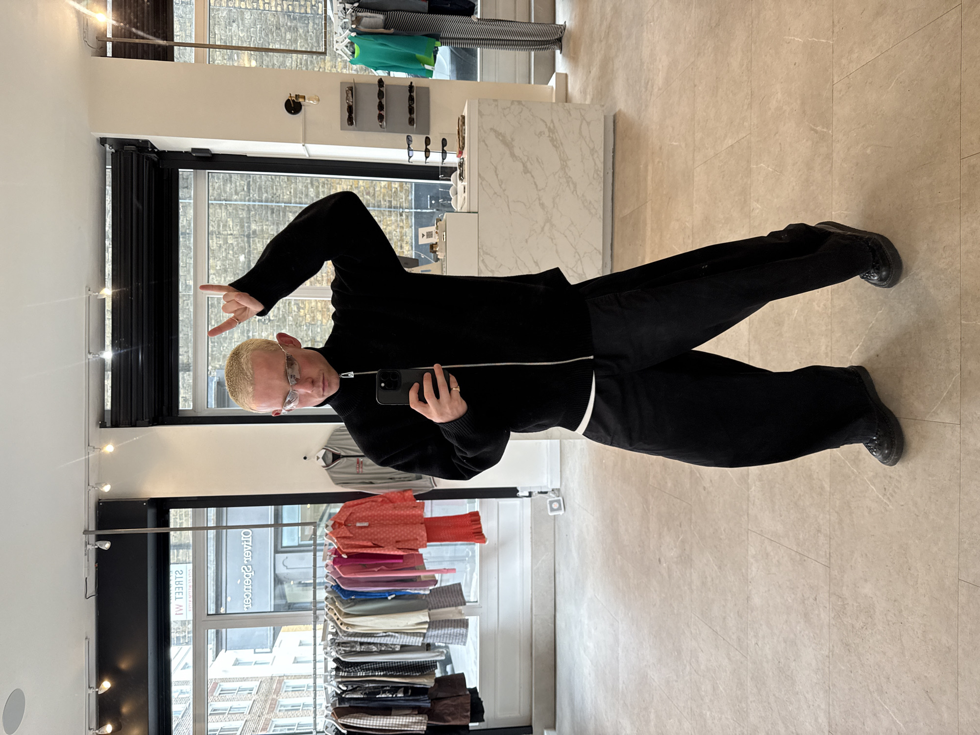 Man Takes Peace Sign Selfie in London Shop