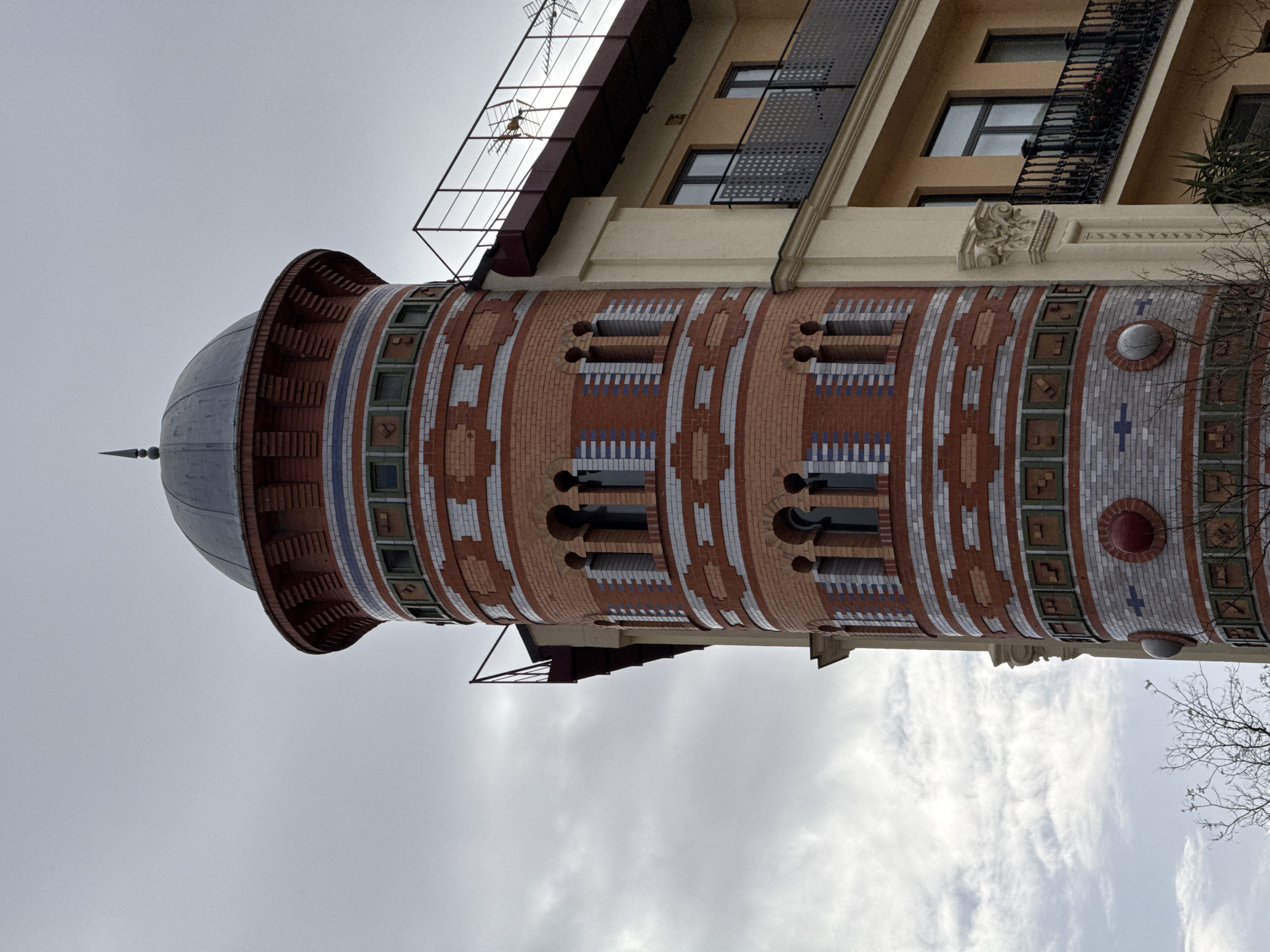 Ornate brick tower with dome documented in Madrid