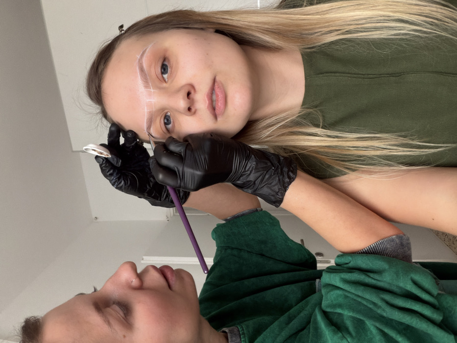 Indoor activities documented in Bat Yam: eyebrow treatment, cat interaction