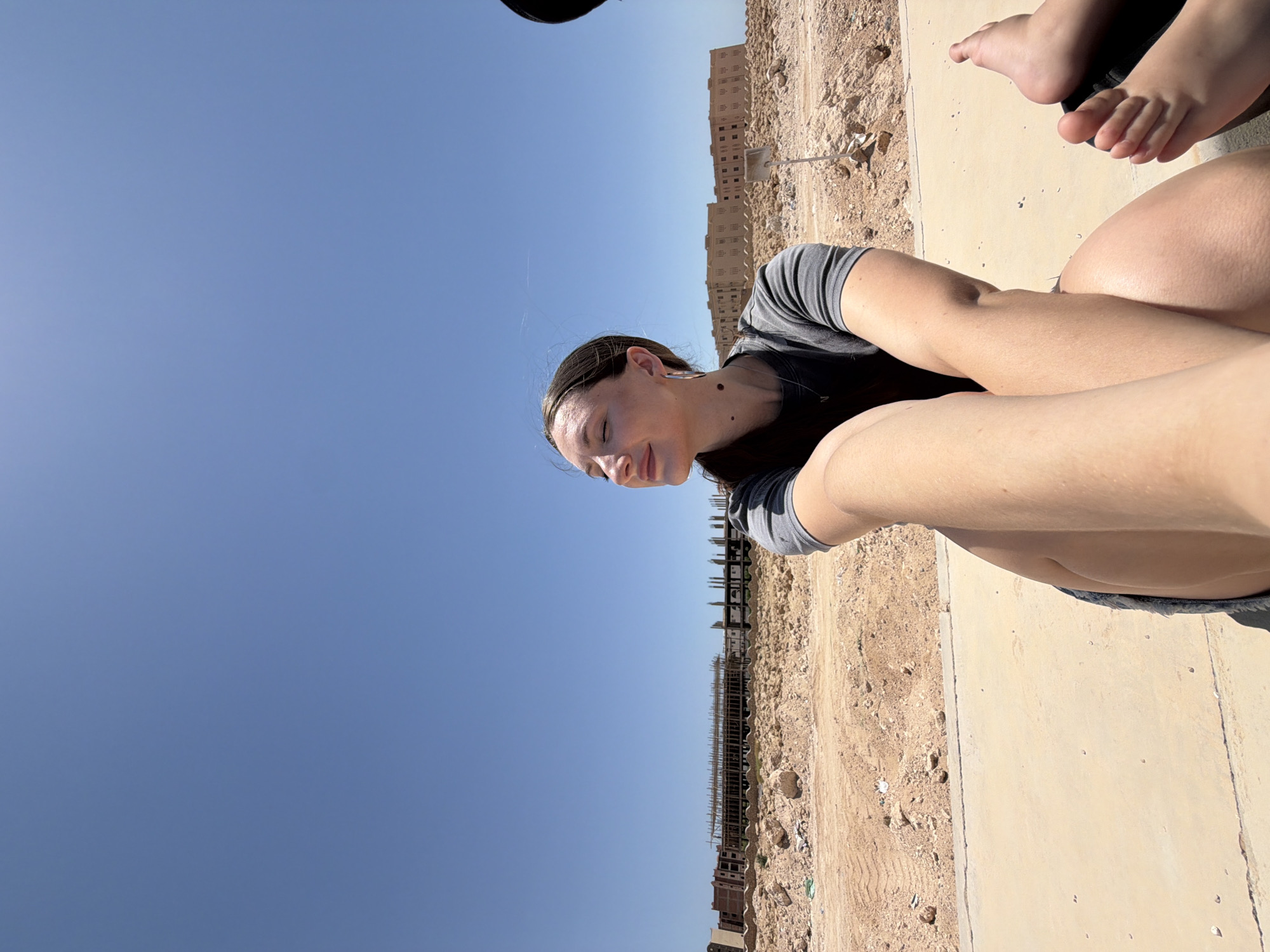 Relaxed morning outdoors near a modern Egyptian complex