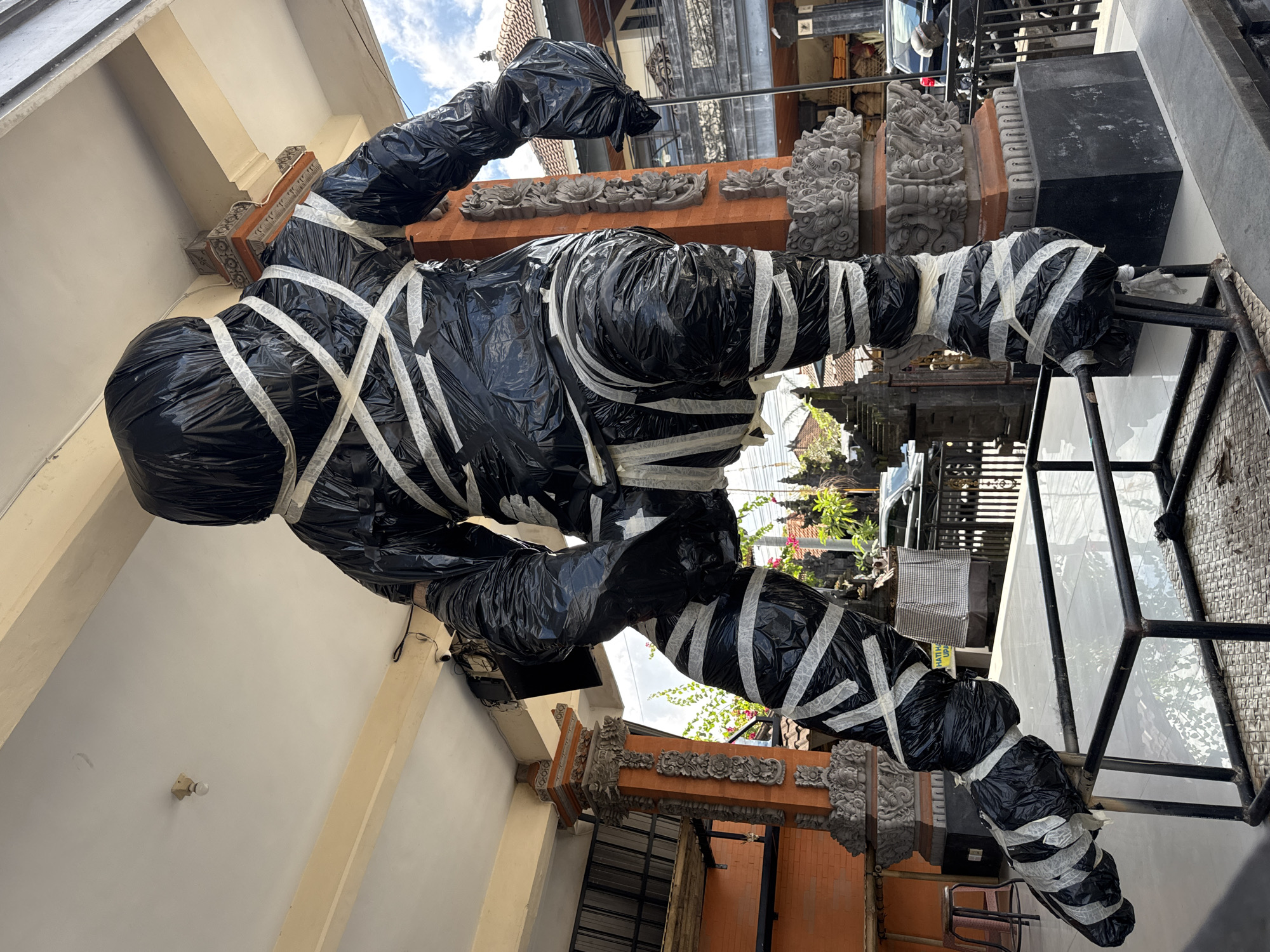Ceremonial effigy wrapped and staged for Balinese ritual in Ubud