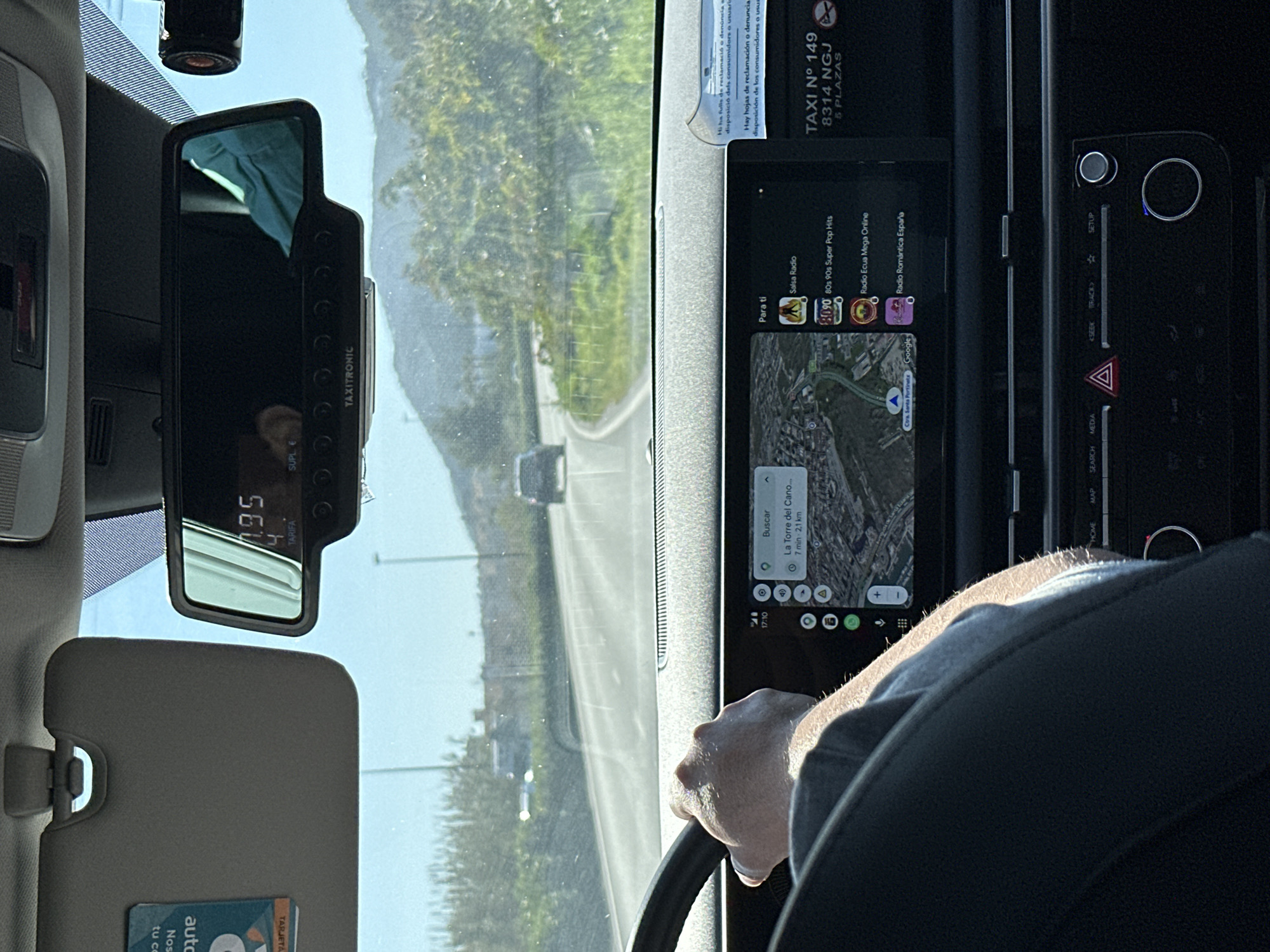 Taxi ride documented in Ibiza showing €1.95 fare, GPS navigation