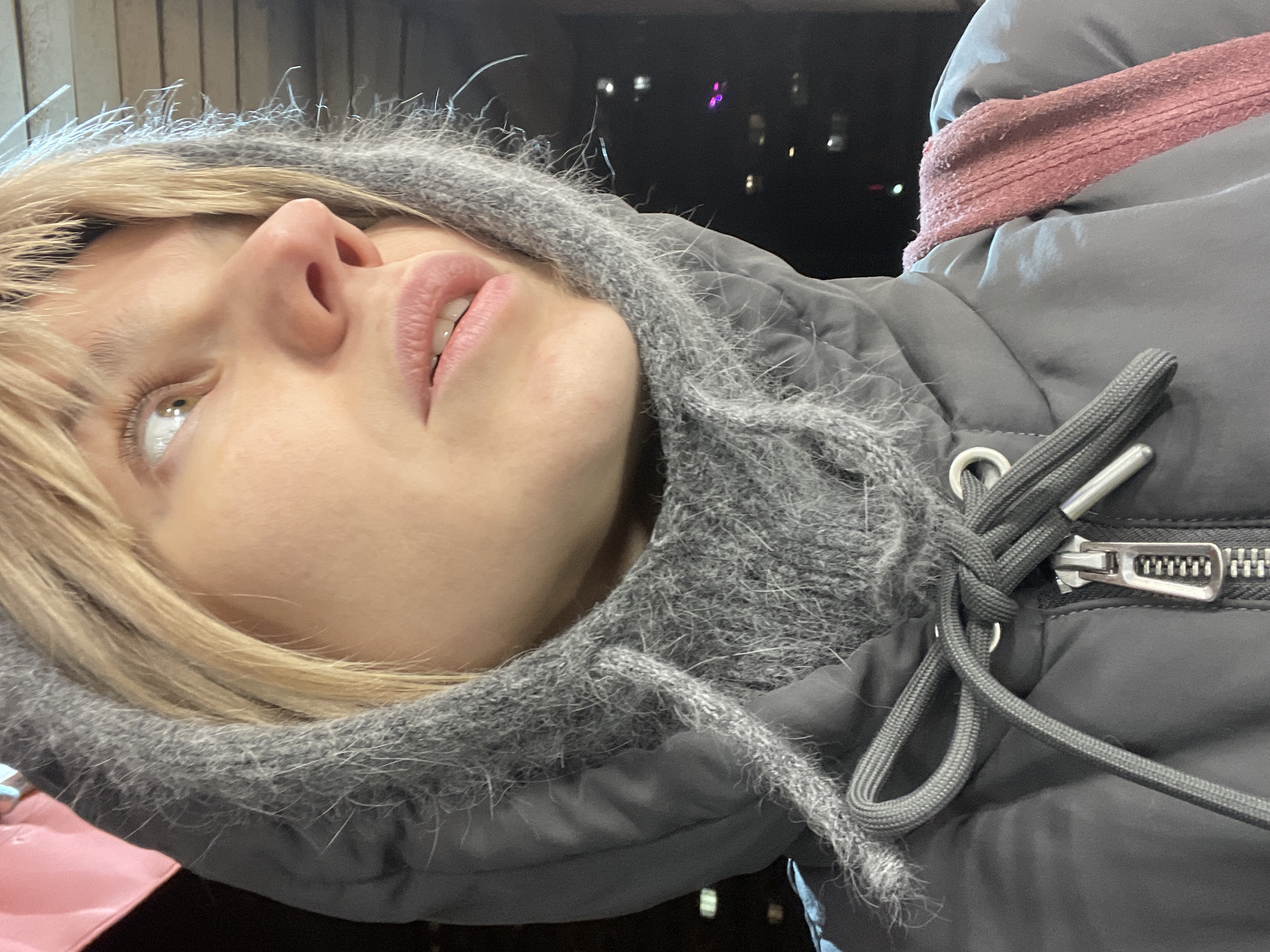 Woman in gray hoodie photographed in Moscow